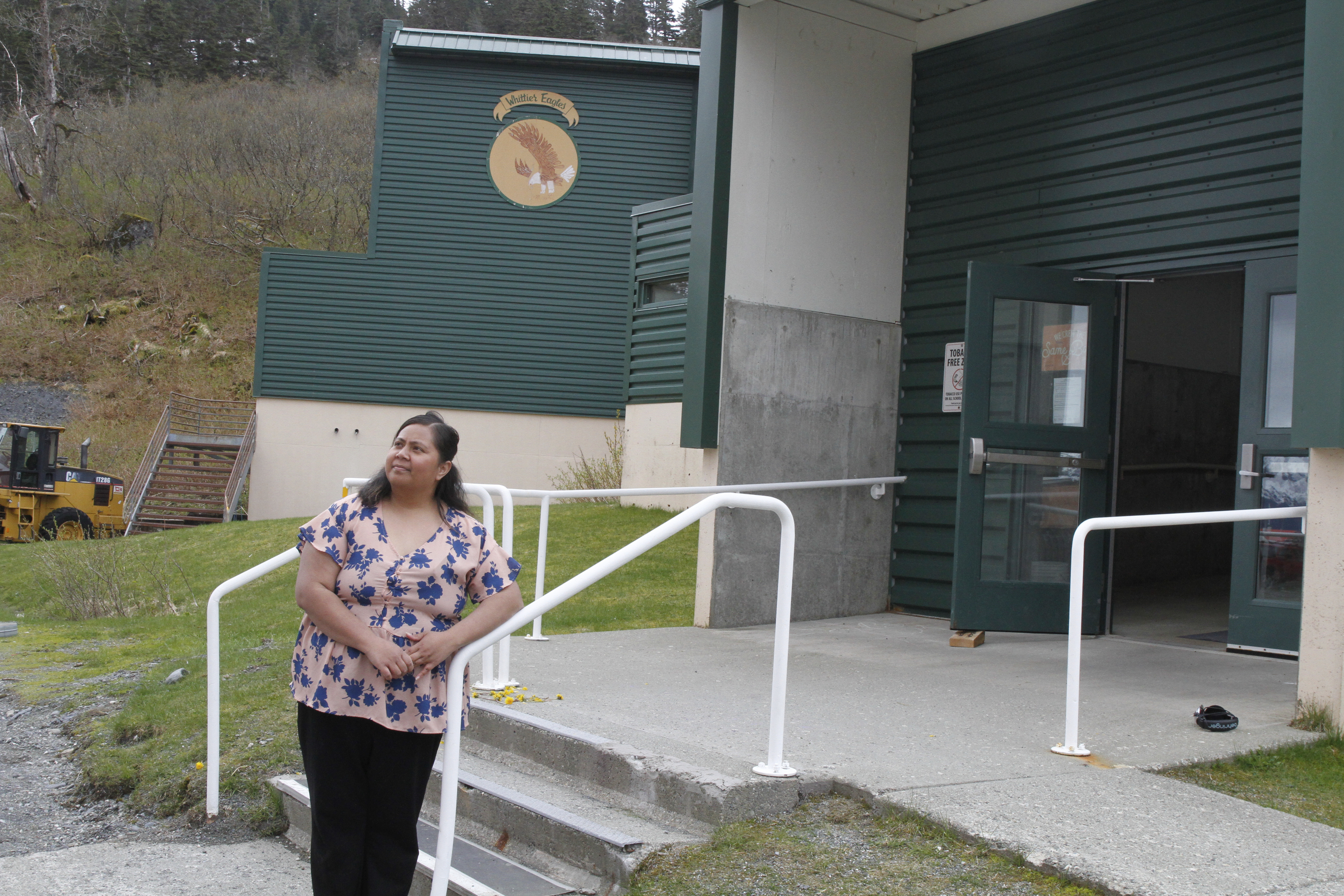 Tupe Smith poses for a photo outside the school in Whittier, Alaska, May 13, 2025. She was elected to the school board in 2023 but a week later was told she could not serve because as a native of American Samoa, she is a U.S. national but not a U.S. citizen. (AP Photo/Mark Thiessen)