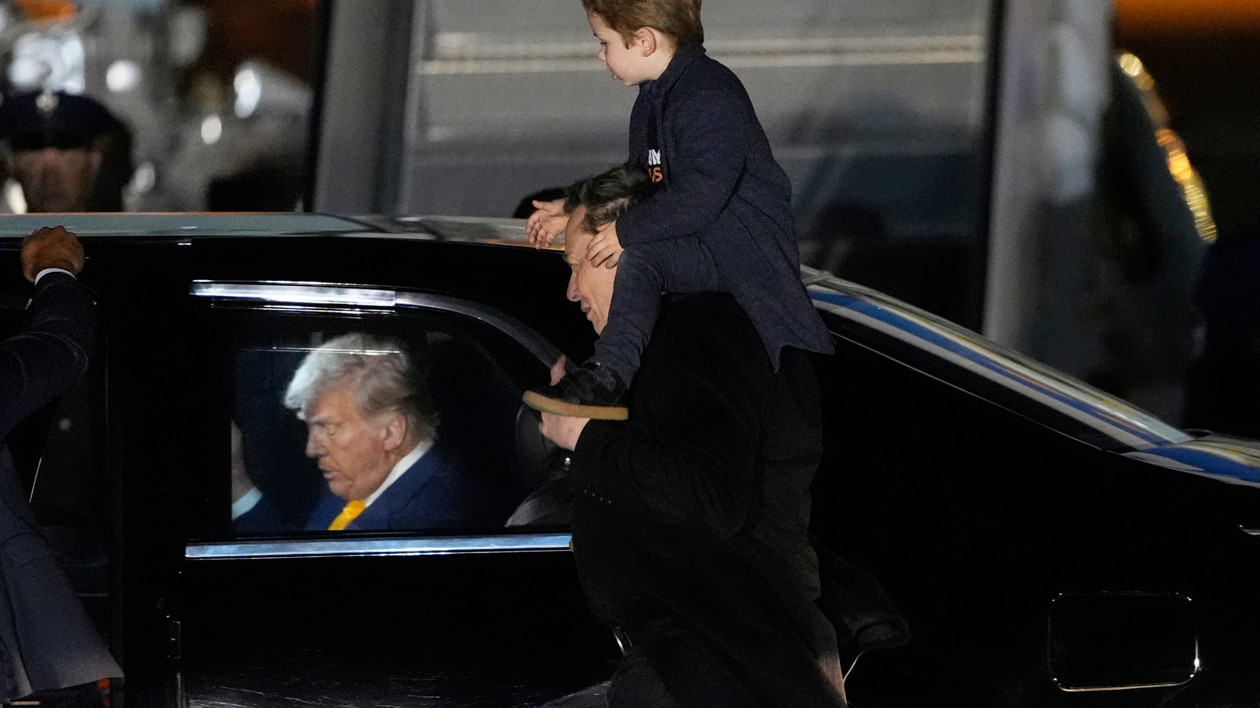 FILE - Elon Musk carries his son X Æ A-Xii as they arrives on Air Force One with President Donald Trump, left, at Miami International Airport, April 12, 2025, in Miami, Fla. (AP Photo/Manuel Balce Ceneta, File)