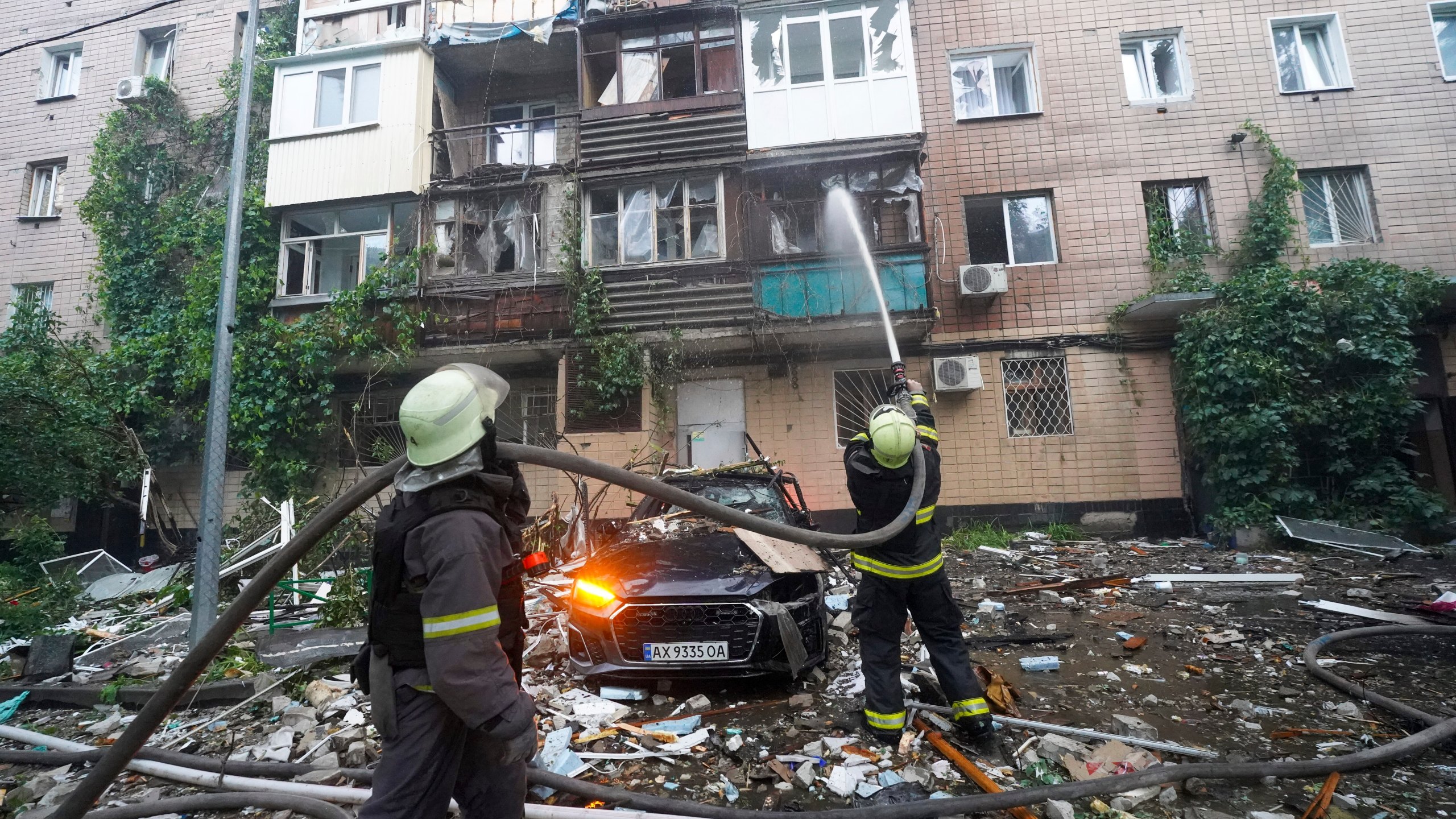 Firefighters tackle a blaze after a Russian attack that hit a residential building in Kharkiv, Ukraine, Saturday, June 7, 2025. (AP Photo/Andrii Marienko)