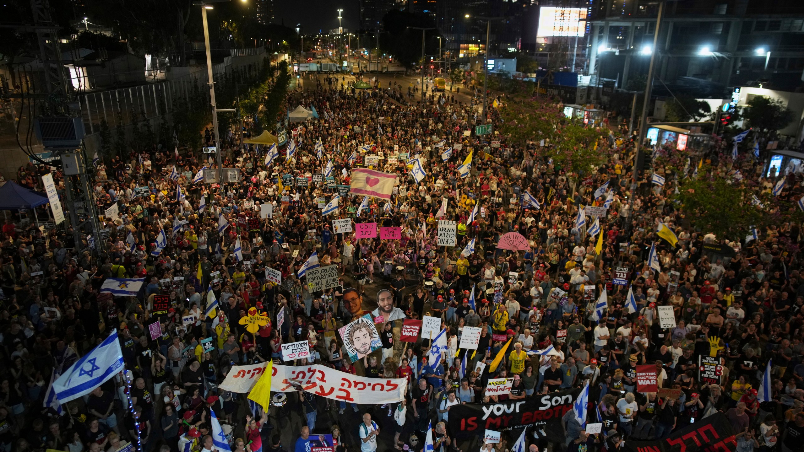People take part in a protest demanding the end of the war and immediate release of hostages held by Hamas in the Gaza Strip, and against Prime Minister Benjamin Netanyahu's government in Tel Aviv, Israel, Saturday, June 7, 2025. (AP Photo/Ohad Zwigenberg)