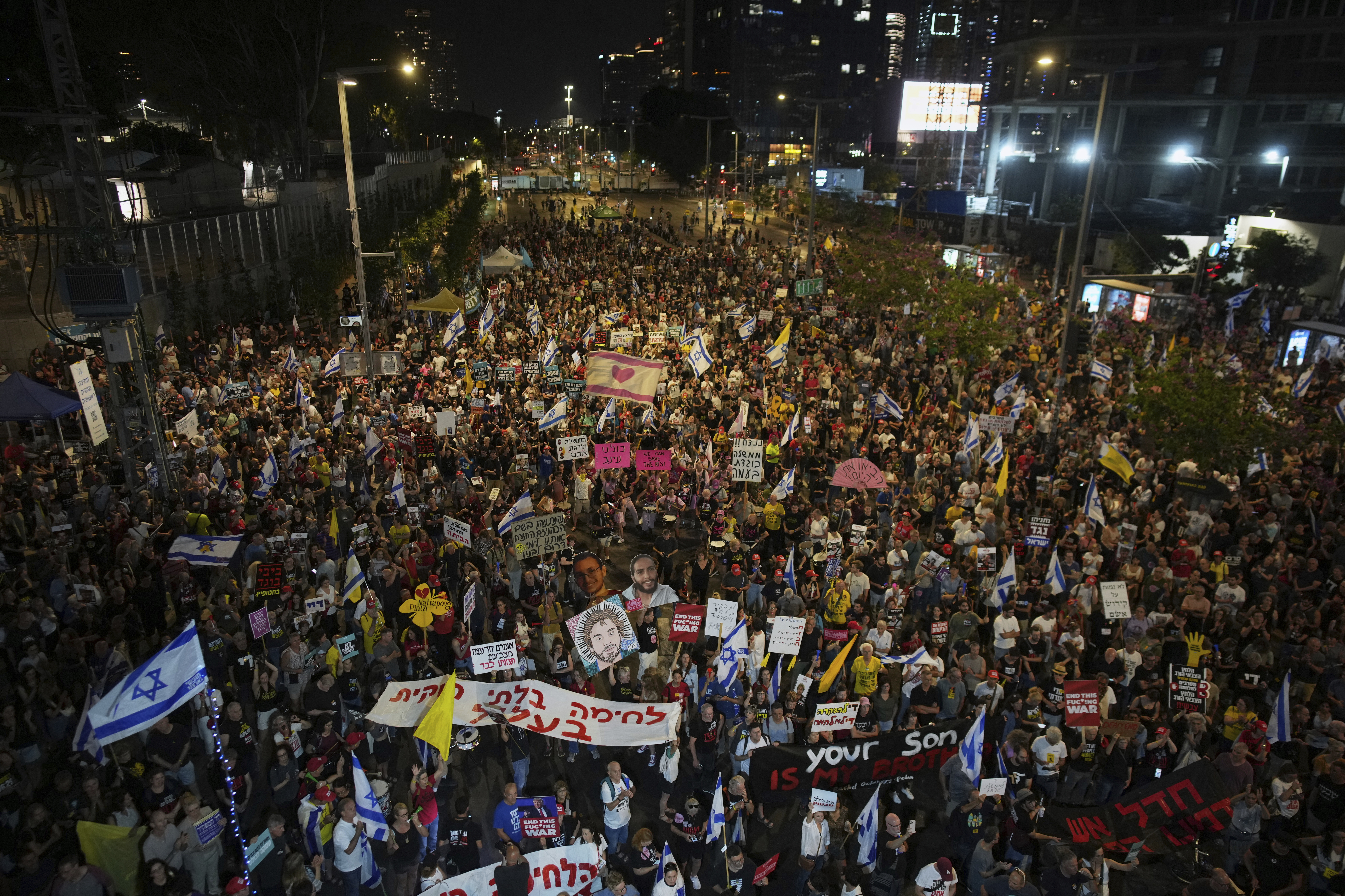 People take part in a protest demanding the end of the war and immediate release of hostages held by Hamas in the Gaza Strip, and against Prime Minister Benjamin Netanyahu's government in Tel Aviv, Israel, Saturday, June 7, 2025. (AP Photo/Ohad Zwigenberg)