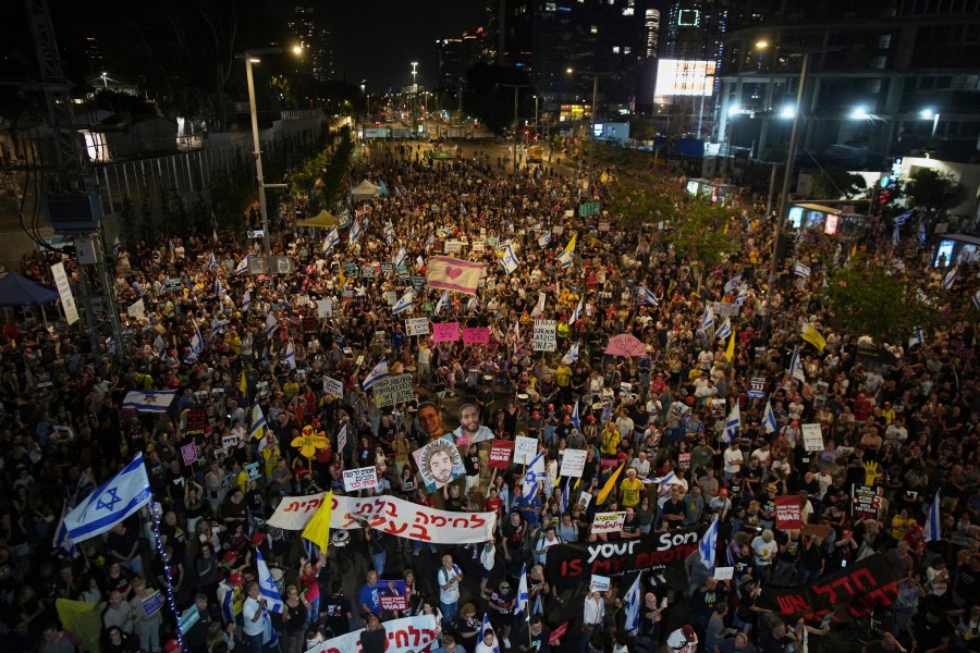 People take part in a protest demanding the end of the war and immediate release of hostages held by Hamas in the Gaza Strip, and against Prime Minister Benjamin Netanyahu's government in Tel Aviv, Israel, Saturday, June 7, 2025. (AP Photo/Ohad Zwigenberg)