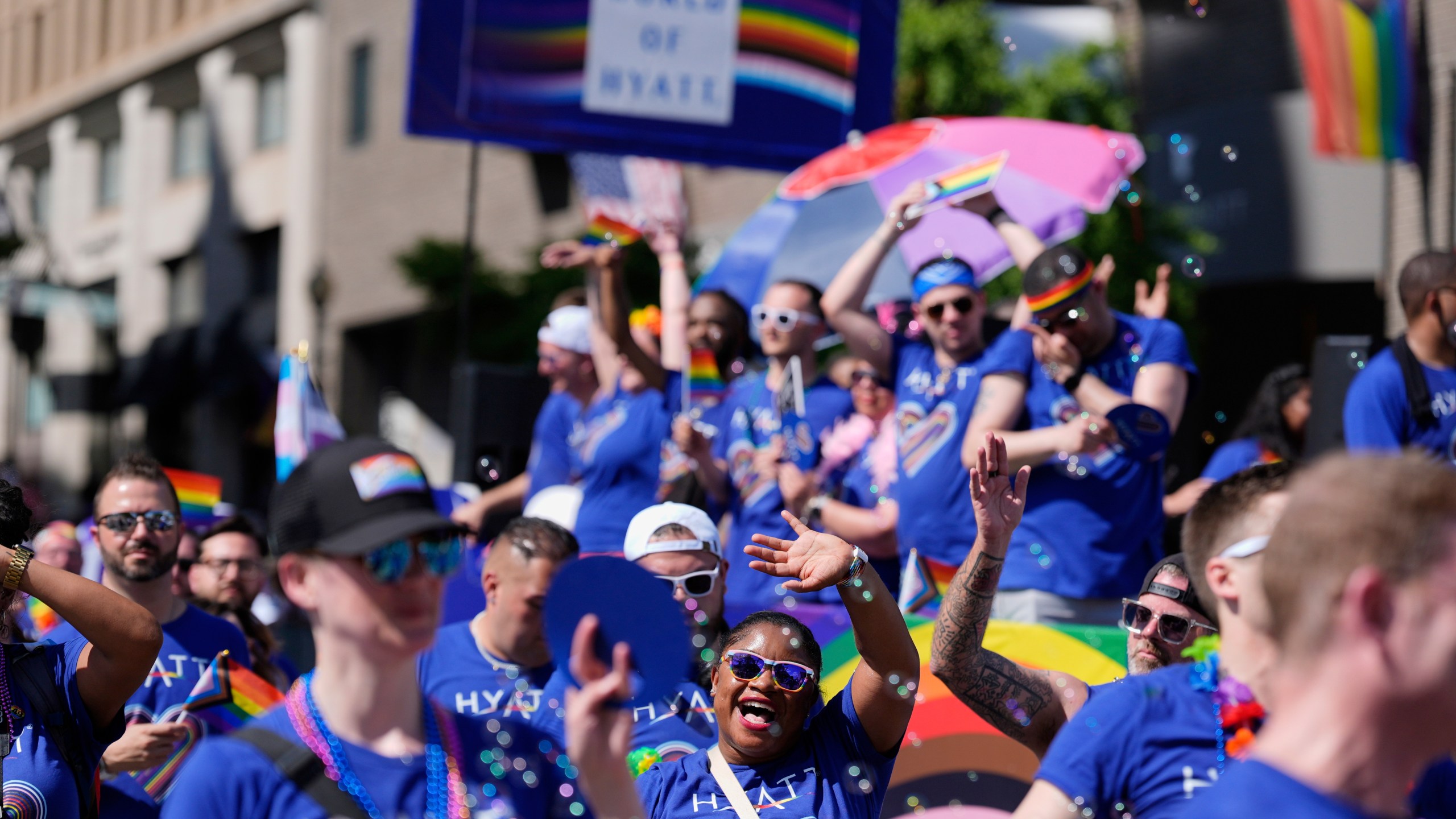 Participants around the World of Hyatt float march during the World Pride parade, Saturday, June 7, 2025, in Washington. (AP Photo/Mark Schiefelbein)