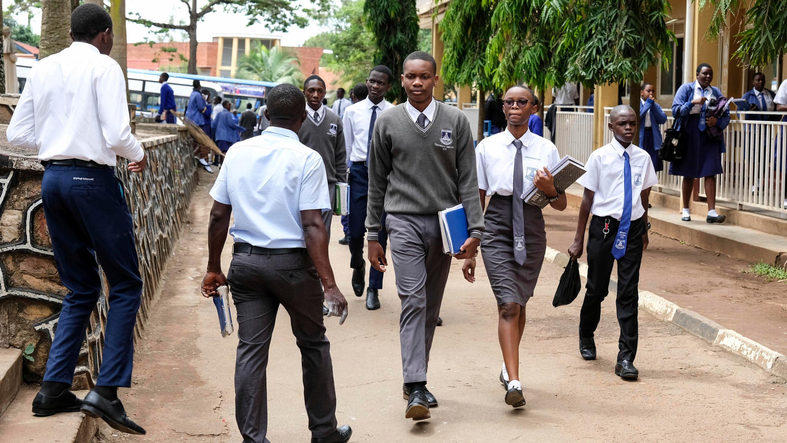 Students walk around the school compound at Uganda Martyrs' Secondary School Namugongo, in Kampala, Uganda Monday, May 26, 2025. (AP Photo/Hajarah Nalwadda)