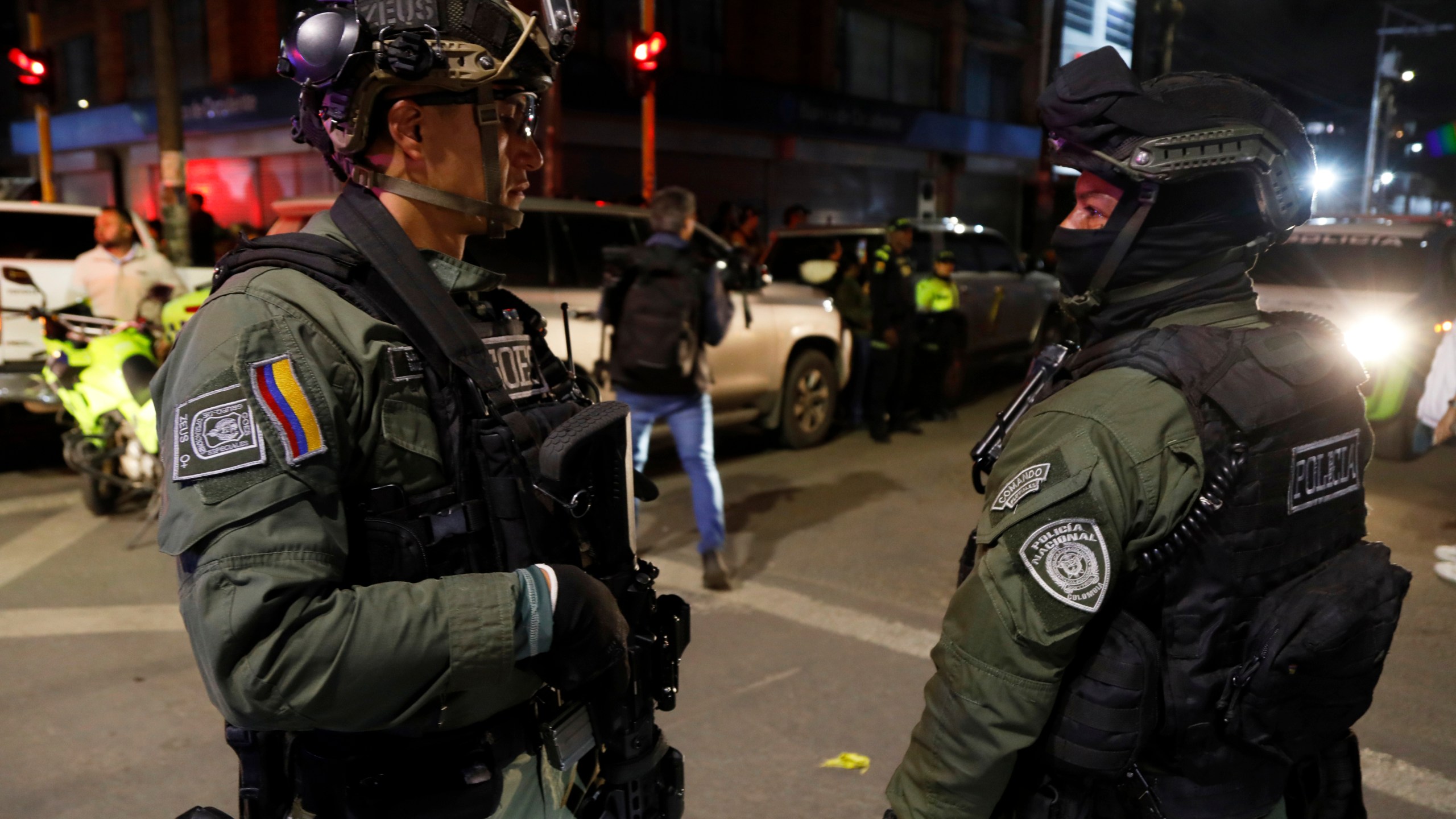Police stand guard outside the Medicentro hospital where Colombian senator and presidential candidate Miguel Uribe Turbay is being treated after he was shot during a campaign rally in Bogota, Colombia, Saturday, June 7, 2025. (AP Photo/Jhon Wilson Vizcaino)