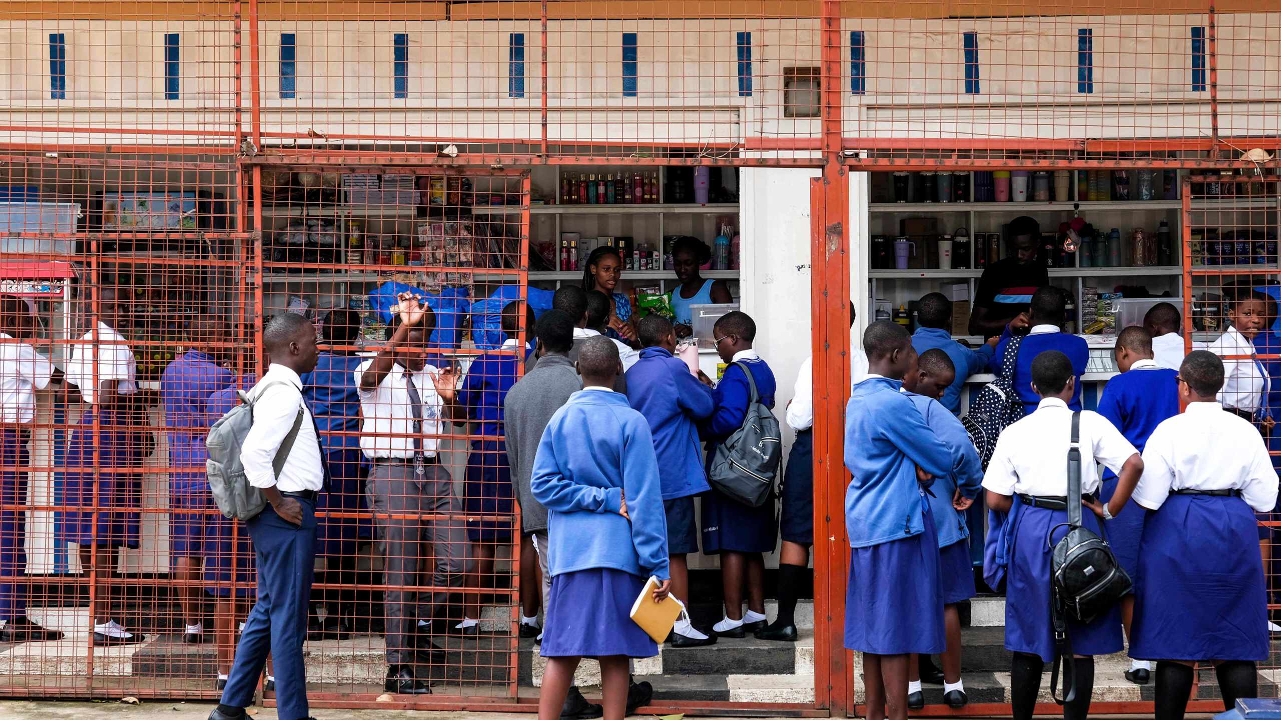 Students shop at the school canteen during lunch break at Uganda Martyrs' Secondary School Namugongo, in Kampala, Uganda Monday, May 26, 2025. (AP Photo/Hajarah Nalwadda)