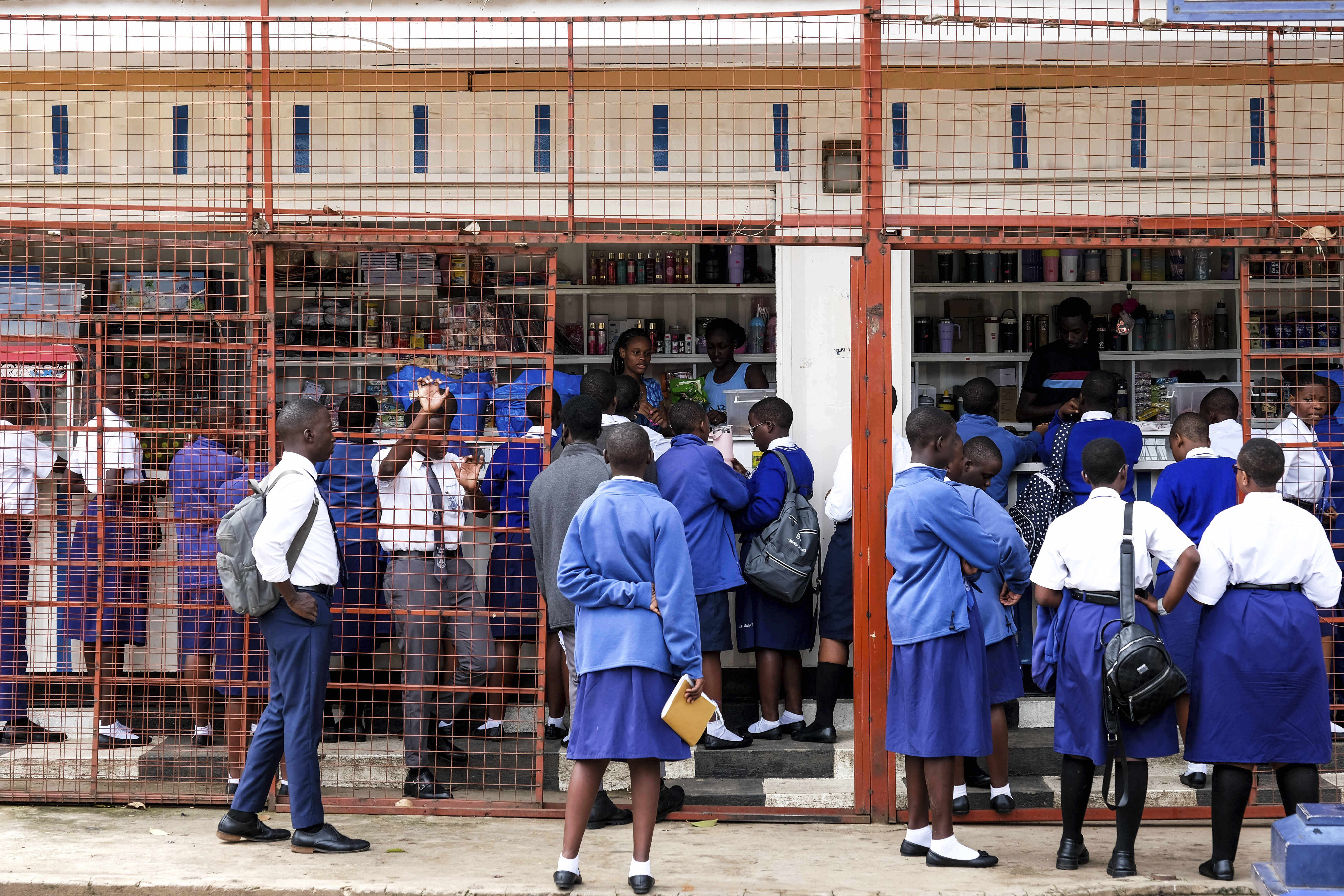 Students shop at the school canteen during lunch break at Uganda Martyrs' Secondary School Namugongo, in Kampala, Uganda Monday, May 26, 2025. (AP Photo/Hajarah Nalwadda)