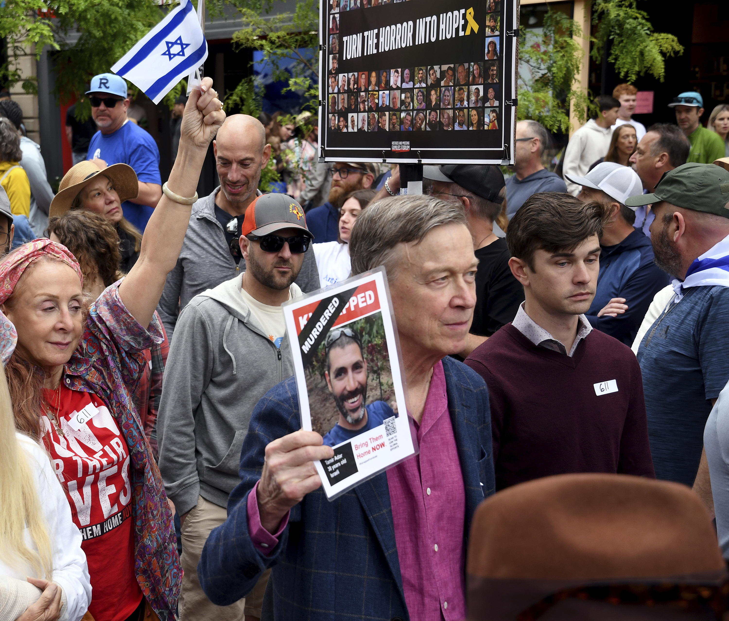 U.S. Sen. John Hickenlooper marches during a rally at the Boulder Jewish Festival in Boulder, Colo., on Sunday, June 8, 2025.(AP Photo/Thomas Peipert)