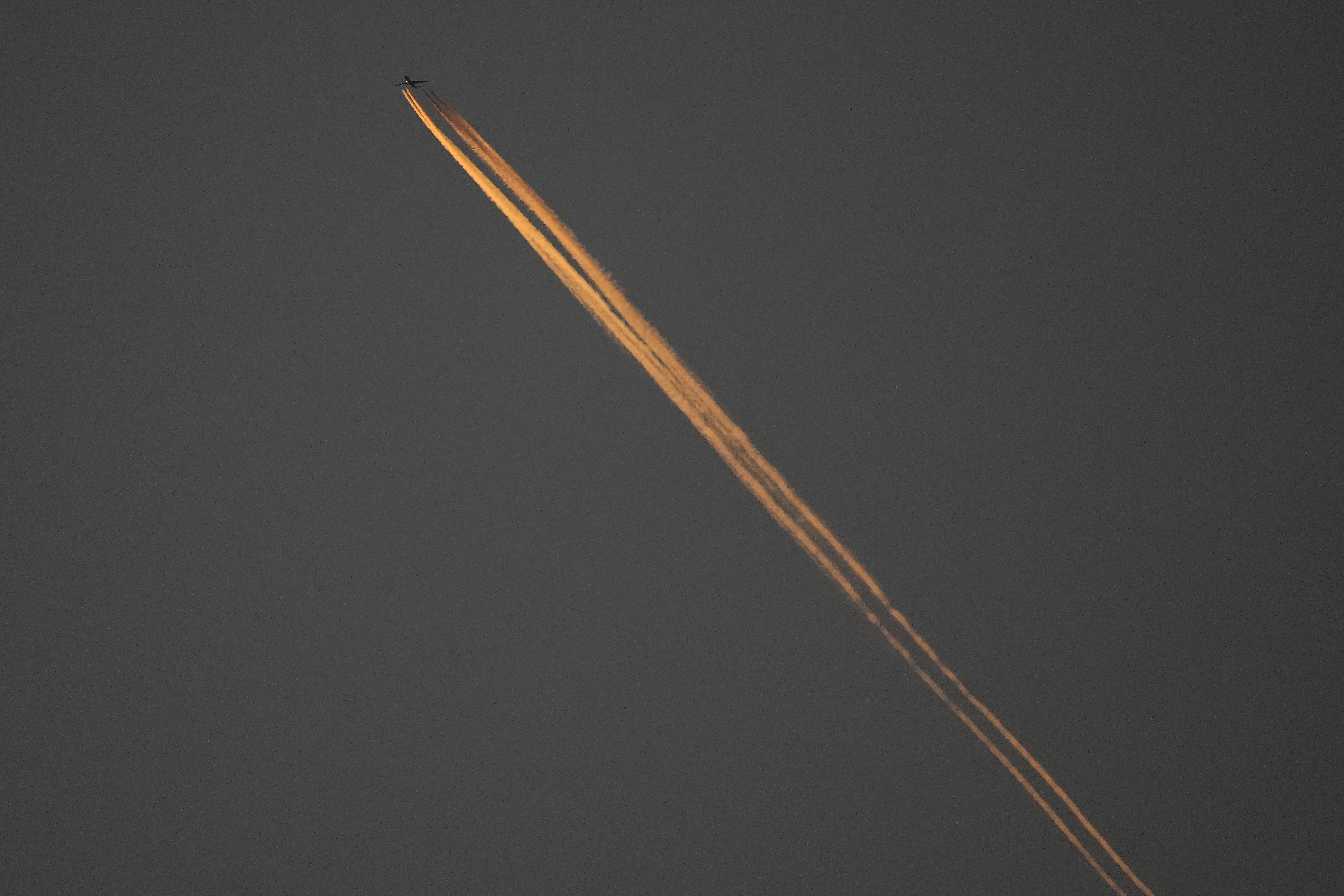FILE - A plane flies over Oakland Alameda Coliseum in Oakland, Calif., April 30, 2024. (AP Photo/Jeff Chiu, File)