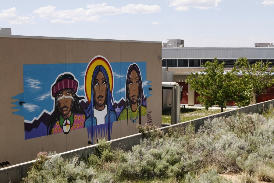 A mural is seen at the Institute for American Indian Arts during summer recess in Santa Fe, N.M., Saturday, June 7, 2025, as Congress proposes a cut-off in annual federal spending allocations to the tribal college. (AP Photo/Morgan Lee)