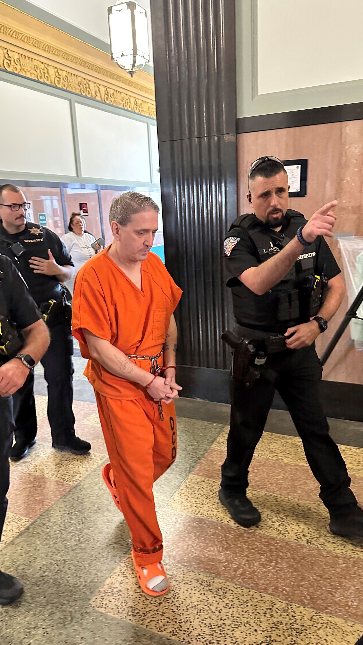 Oklahoma County Sheriff's deputies lead longtime death row inmate Richard Glossip to a courtroom on Monday, June 9, 2025, at the Oklahoma County Courthouse in Oklahoma City. (AP Photo/Sean Murphy)