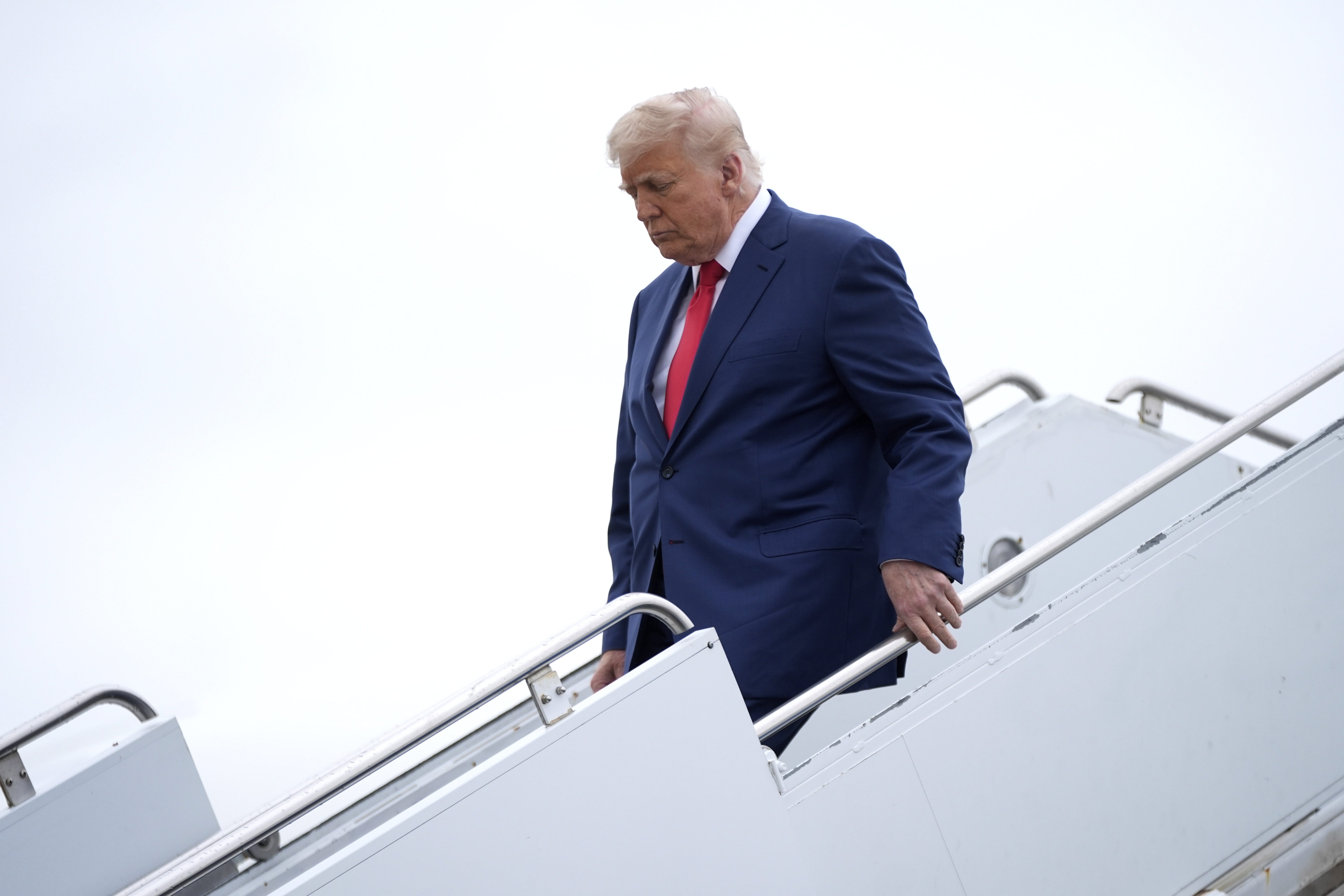 President Donald Trump arrives on Air Force One at Hagerstown Regional Airport, in Hagerstown, Md., on his was to Camp David, Md., Sunday, June 8, 2025. (AP Photo/Manuel Balce Ceneta)