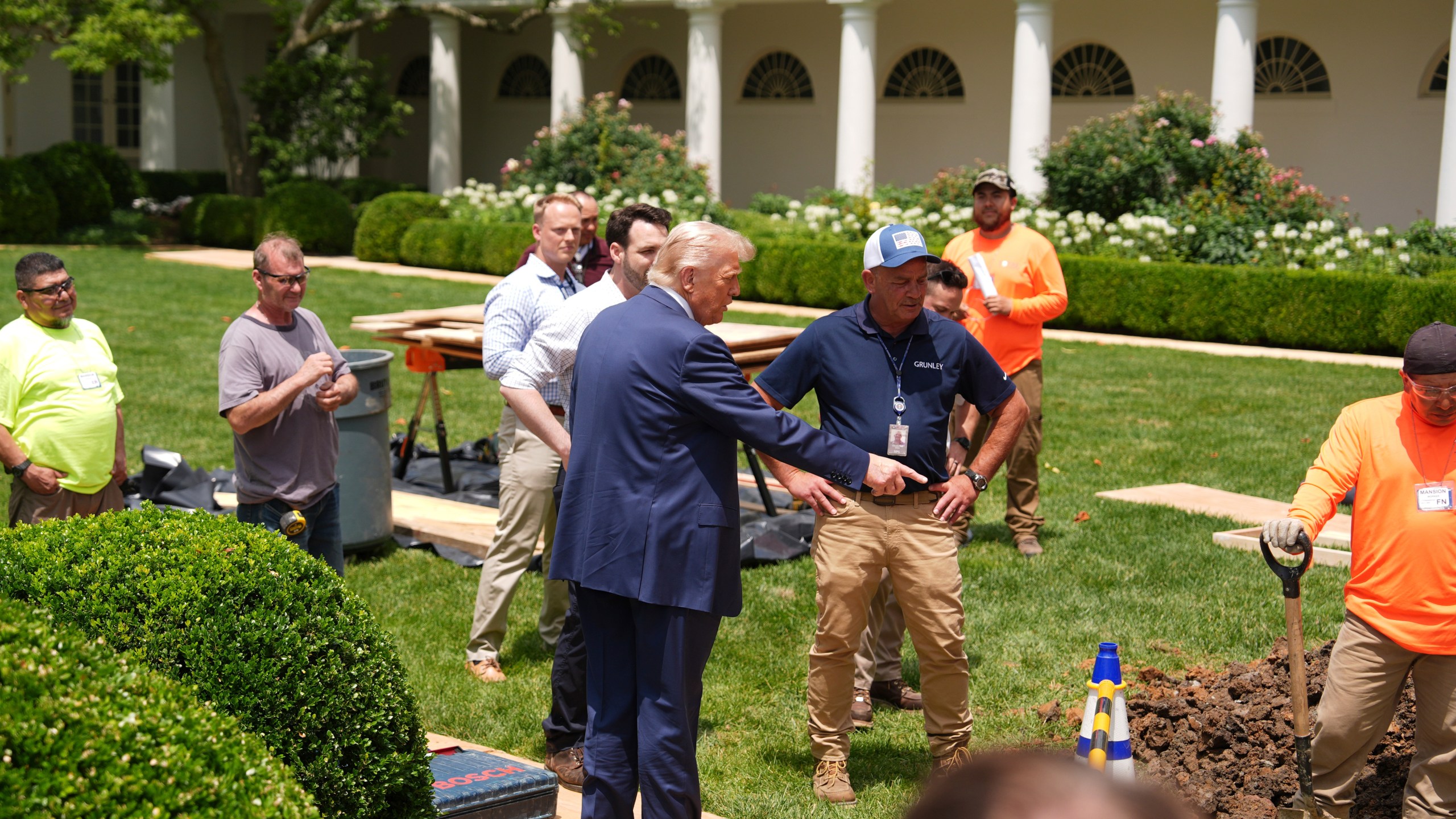 President Donald Trump looks over a construction project in the Rose Garden of the White House, after his arrival, Monday, June 9, 2025, in Washington. (AP Photo/Evan Vucci)