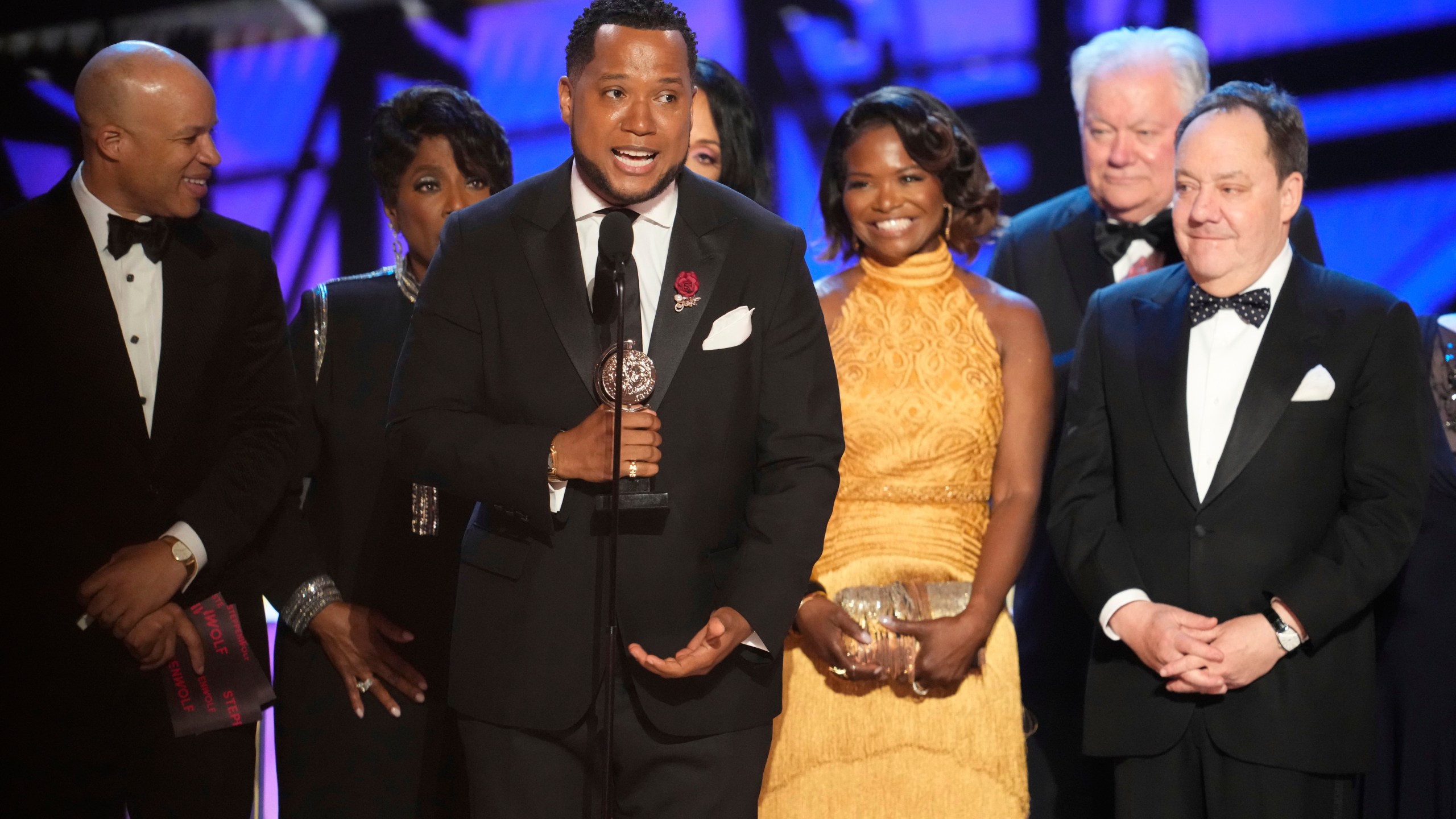 Branden Jacobs-Jenkins, center, accepts the award for best play for "Purpose" during the 78th Tony Awards on Sunday, June 8, 2025, at Radio City Music Hall in New York. (Photo by Charles Sykes/Invision/AP)