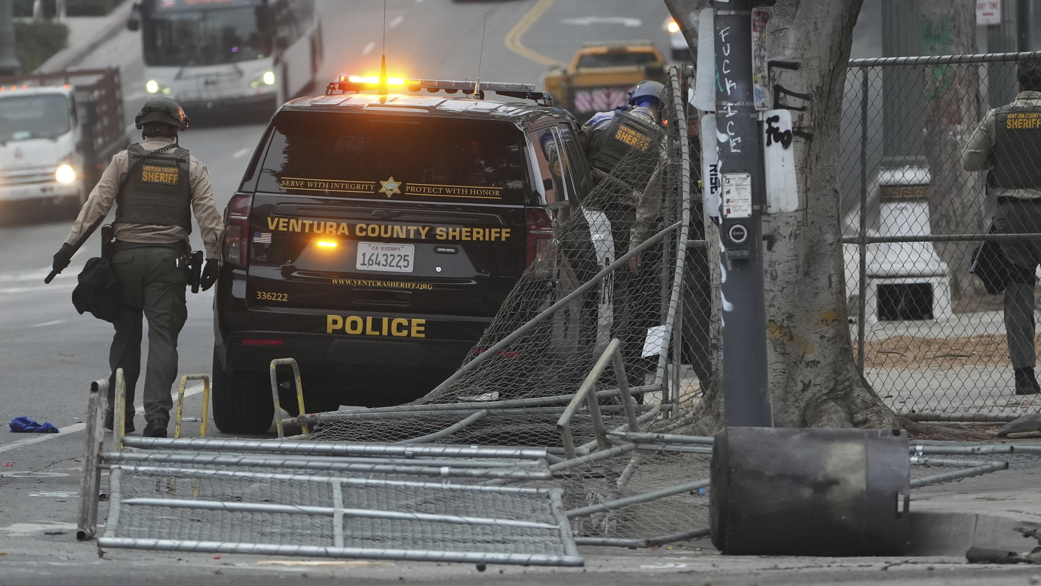 Police patrol the scene after a night of protests in downtown Los Angeles, Monday, June 9, 2025. (AP Photo/Damian Dovarganes)
