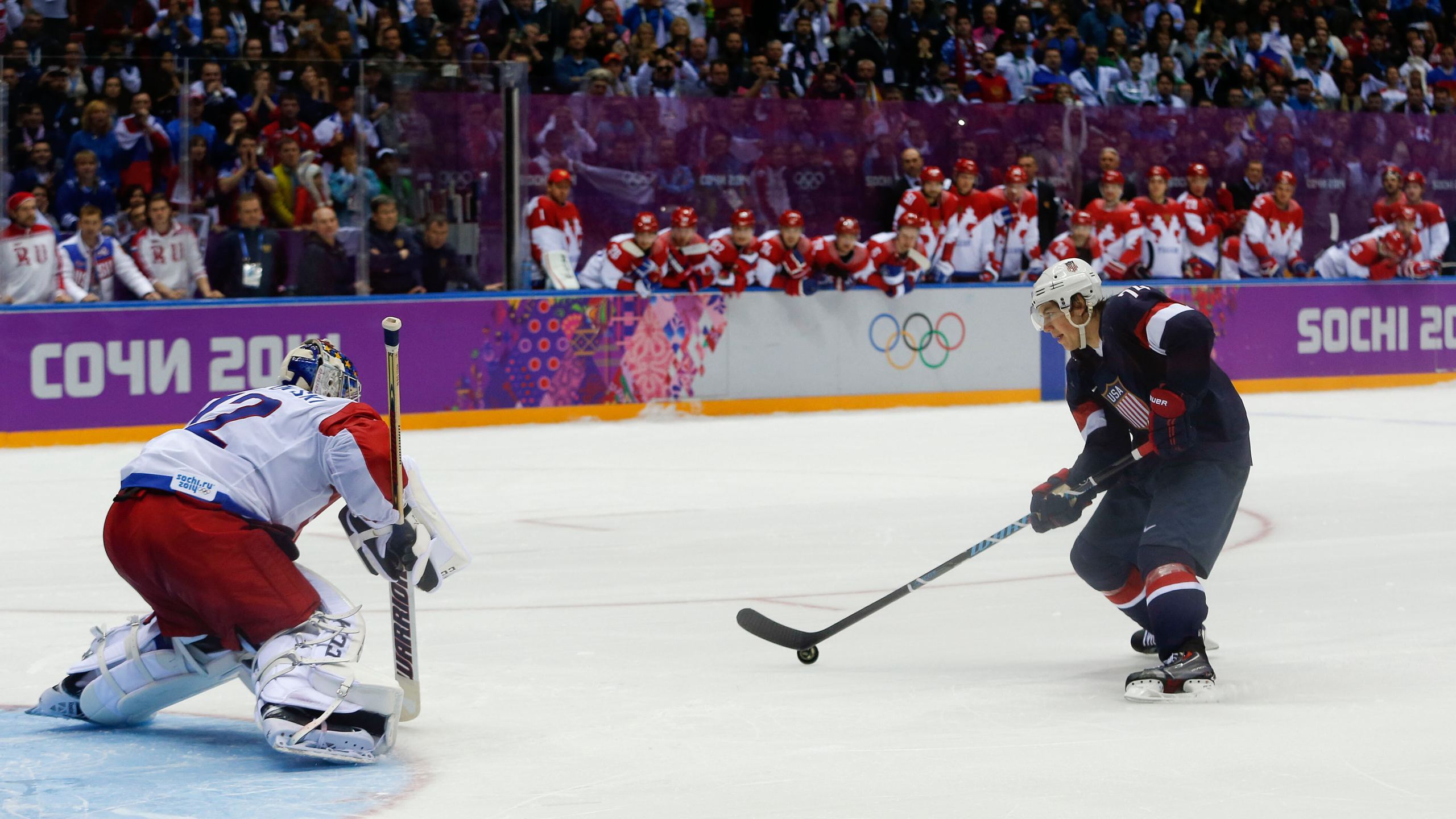 FILE - USA forward T.J. Oshie prepares to take a shot against Russia goaltender Sergei Bobrovski in an overtime shootout during a men's ice hockey game at the 2014 Winter Olympics, Saturday, Feb. 15, 2014, in Sochi, Russia. Oshie scored the winning goal and the USA won 3-2. (AP Photo/Julio Cortez, File)