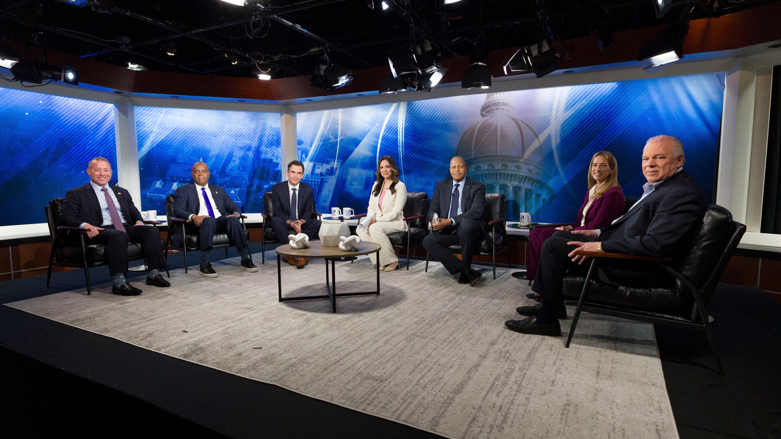 FILE - From left, New Jersey Rep. Josh Gottheimer; Newark Mayor Ras Baraka; Jersey City Mayor Steve Fulop; moderator NJ Spotlight News anchor Briana Vannozzi; moderator WNYC Morning Edition host Michael Hill; New Jersey Rep. Mikie Sherrill; and former state Senate President Steve Sweeney attend the New Jersey Democratic gubernatorial primary debate Monday, May 12, 2025, in Newark, N.J. (Steve Hockstein/NJ Advance Media via AP, Pool, File)
