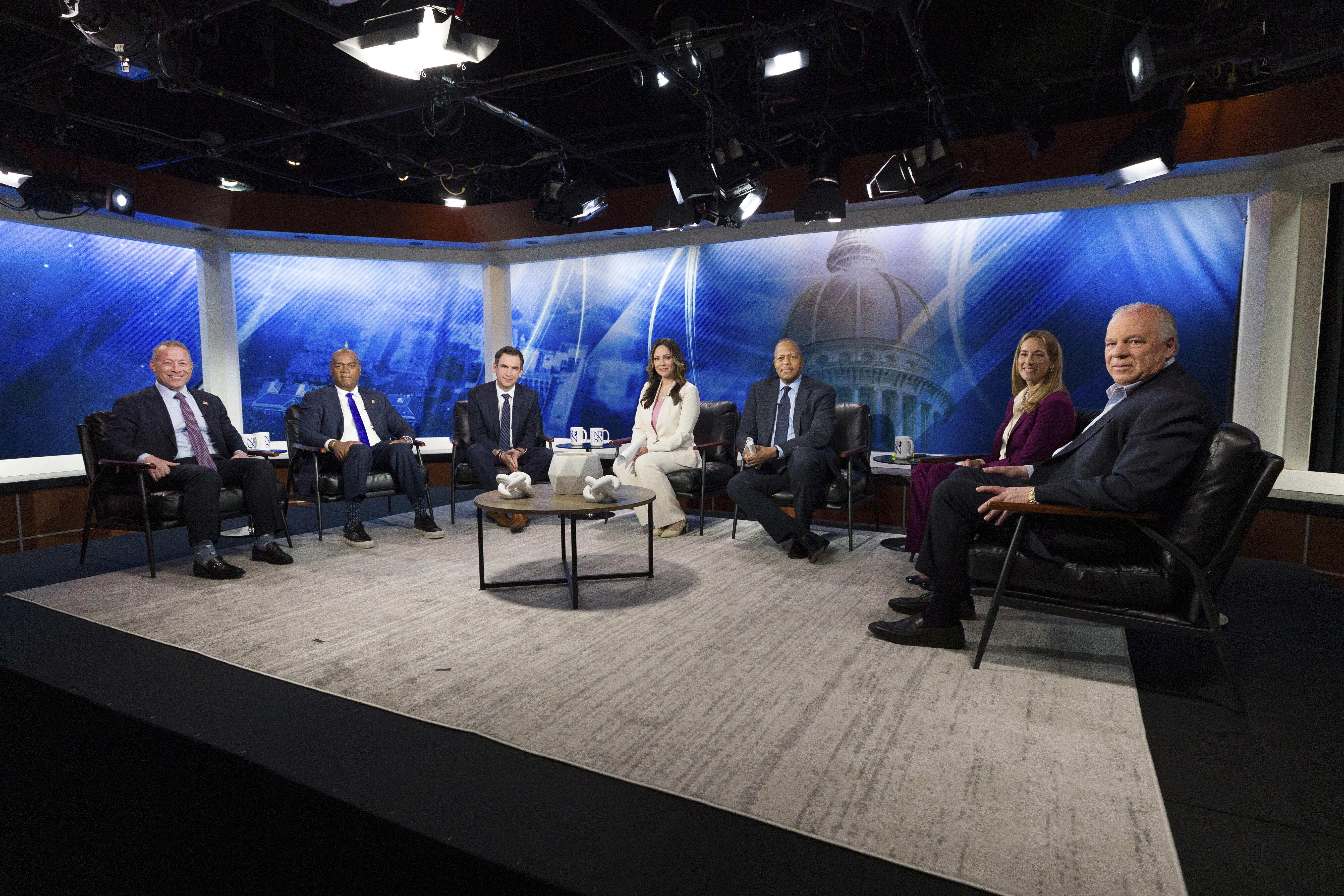 FILE - From left, New Jersey Rep. Josh Gottheimer; Newark Mayor Ras Baraka; Jersey City Mayor Steve Fulop; moderator NJ Spotlight News anchor Briana Vannozzi; moderator WNYC Morning Edition host Michael Hill; New Jersey Rep. Mikie Sherrill; and former state Senate President Steve Sweeney attend the New Jersey Democratic gubernatorial primary debate Monday, May 12, 2025, in Newark, N.J. (Steve Hockstein/NJ Advance Media via AP, Pool, File)
