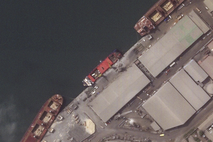 This satellite image provided by Planet Labs PBC shows the Russian flagged cargo ship, Patria, unloading military vehicles, May, 27, 2024, in Conakry, Guinea. (Planet Labs PBC via AP)
