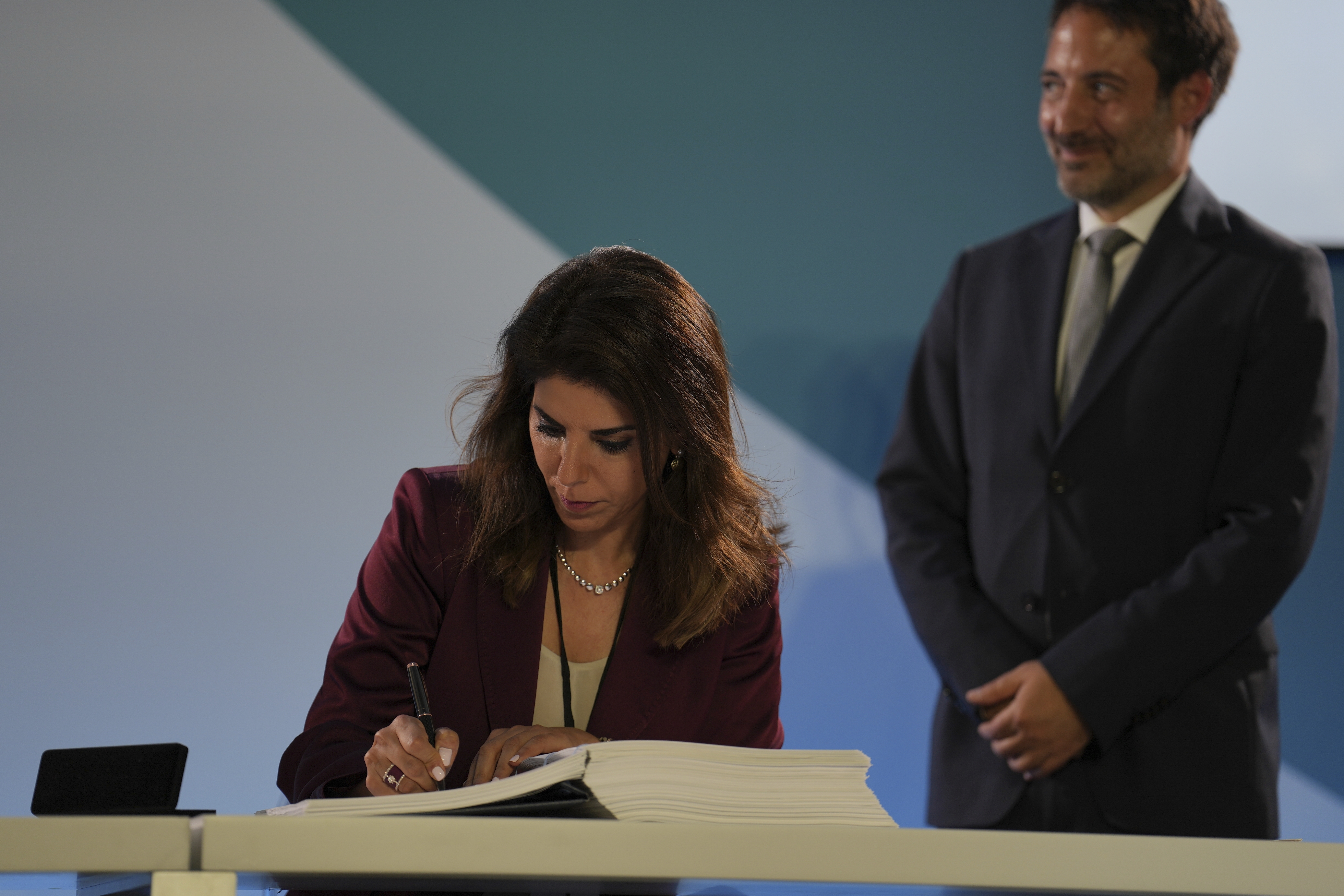 Diplomat Leena Al-Hadid, of Jordan, signs the High Seas Treaty during the U.N. Ocean Conference, Monday, June 9, 2025, in Nice, France. (AP Photo/Annika Hammerschlag)