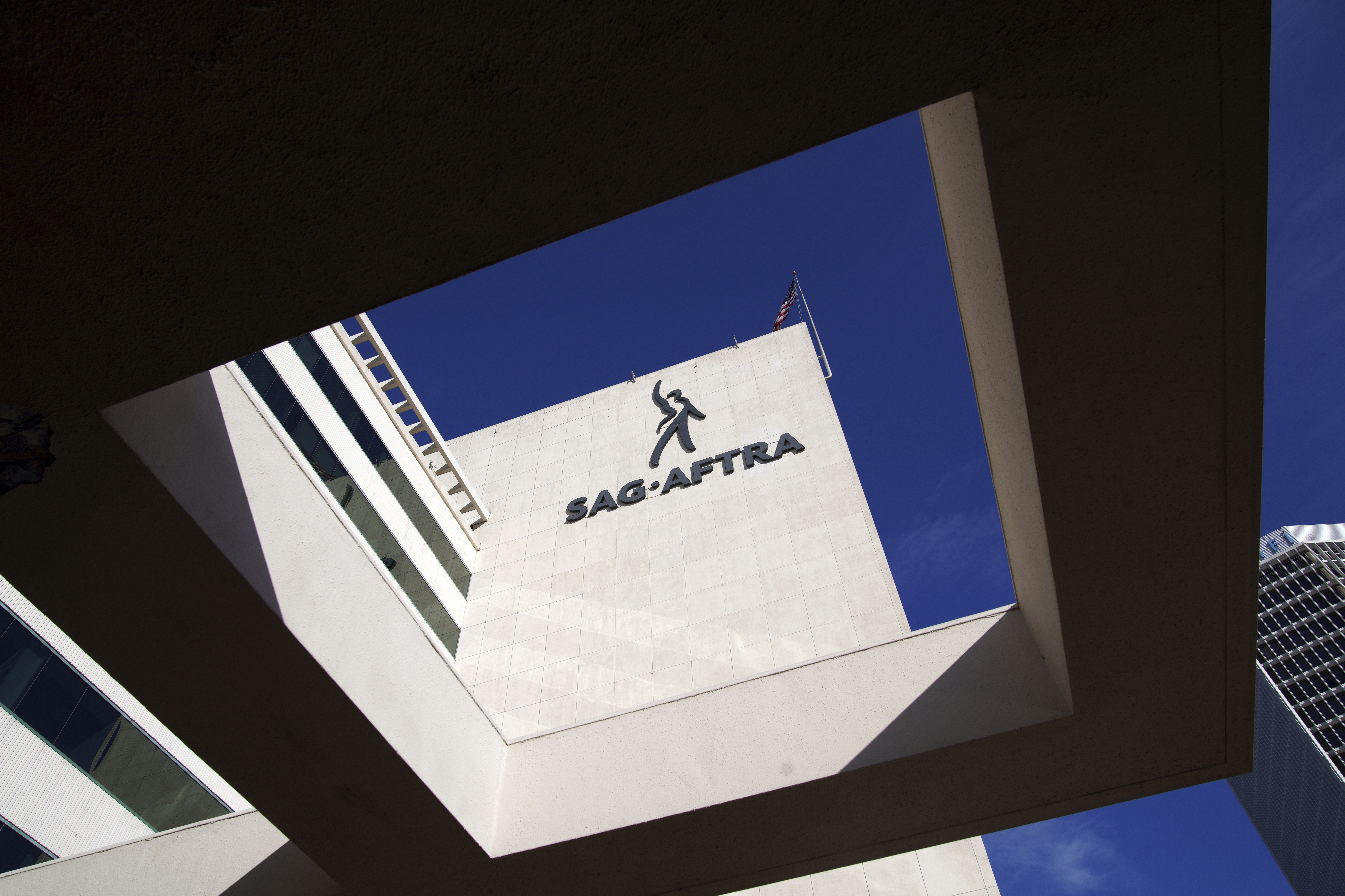 FILE - SAG-AFTRA signage is seen on the side of the headquarters in Los Angeles on Friday, Nov. 10, 2023. (AP Photo/Richard Vogel,File)