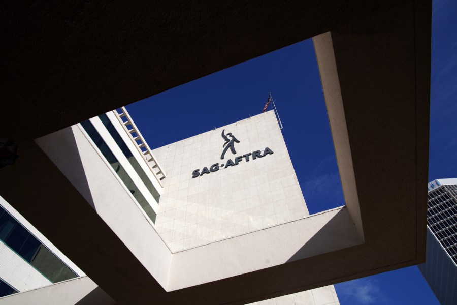 FILE - SAG-AFTRA signage is seen on the side of the headquarters in Los Angeles on Friday, Nov. 10, 2023. (AP Photo/Richard Vogel,File)