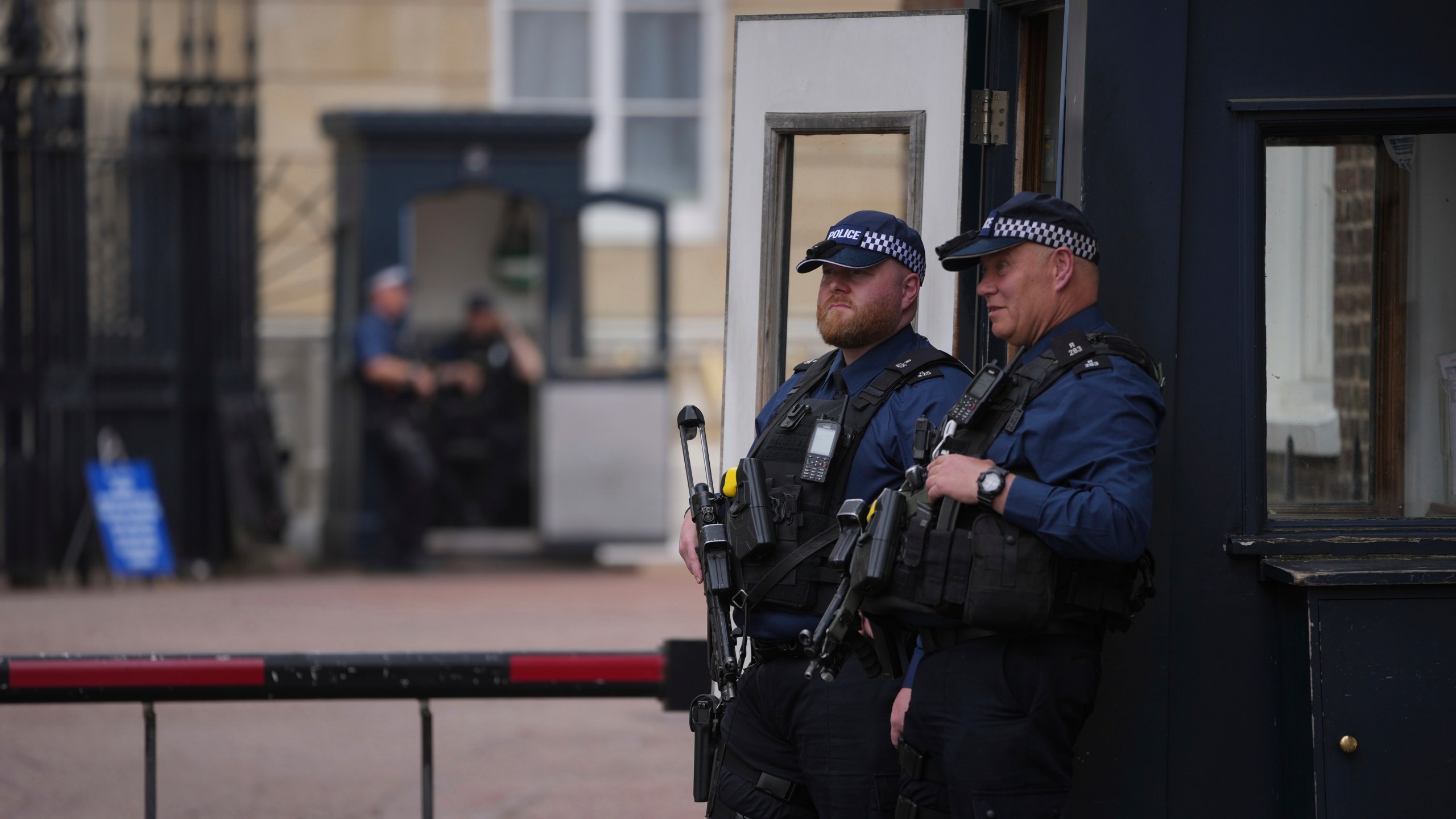 Police officers stand guard at the entrance of Lancaster House, where the trade talks between the U.S. and China are taking place, in London, Monday, June 9, 2025. (AP Photo/Kin Cheung)