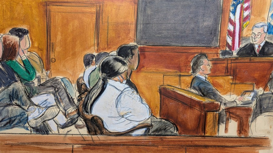 Judge Curtis Farber, right, reads the instructions regarding reaching a unanimous verdict to the jury, Monday, June 9, 2025, at Manhattan criminal court in New York. (Elizabeth Williams via AP)