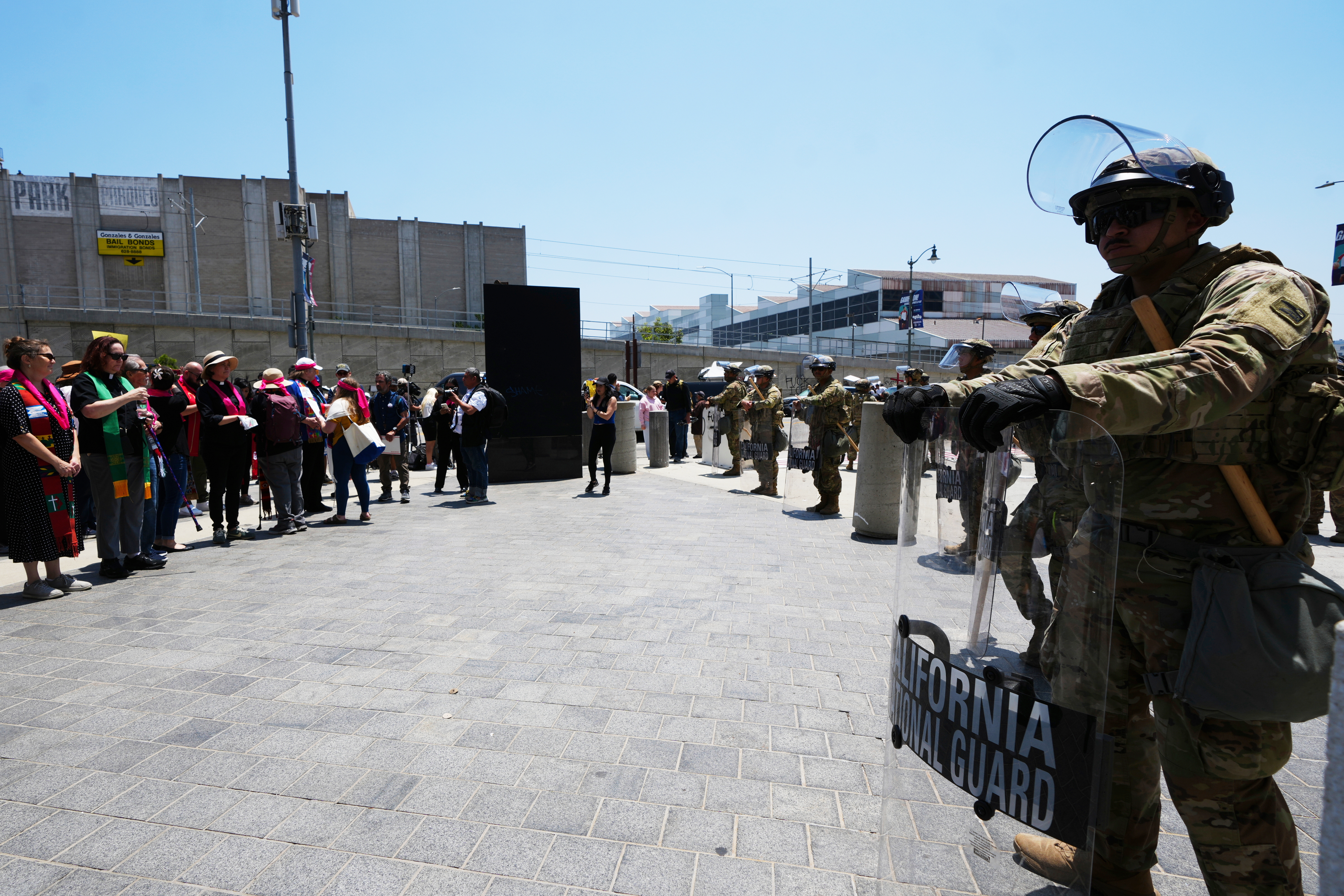 U.S. National Guard stand by as protesters gather to denounce ICE, U.S Immigration and Customs Enforcement, operations Tuesday, June 10, 2025, in Los Angeles. (AP Photo Damian Dovarganes)