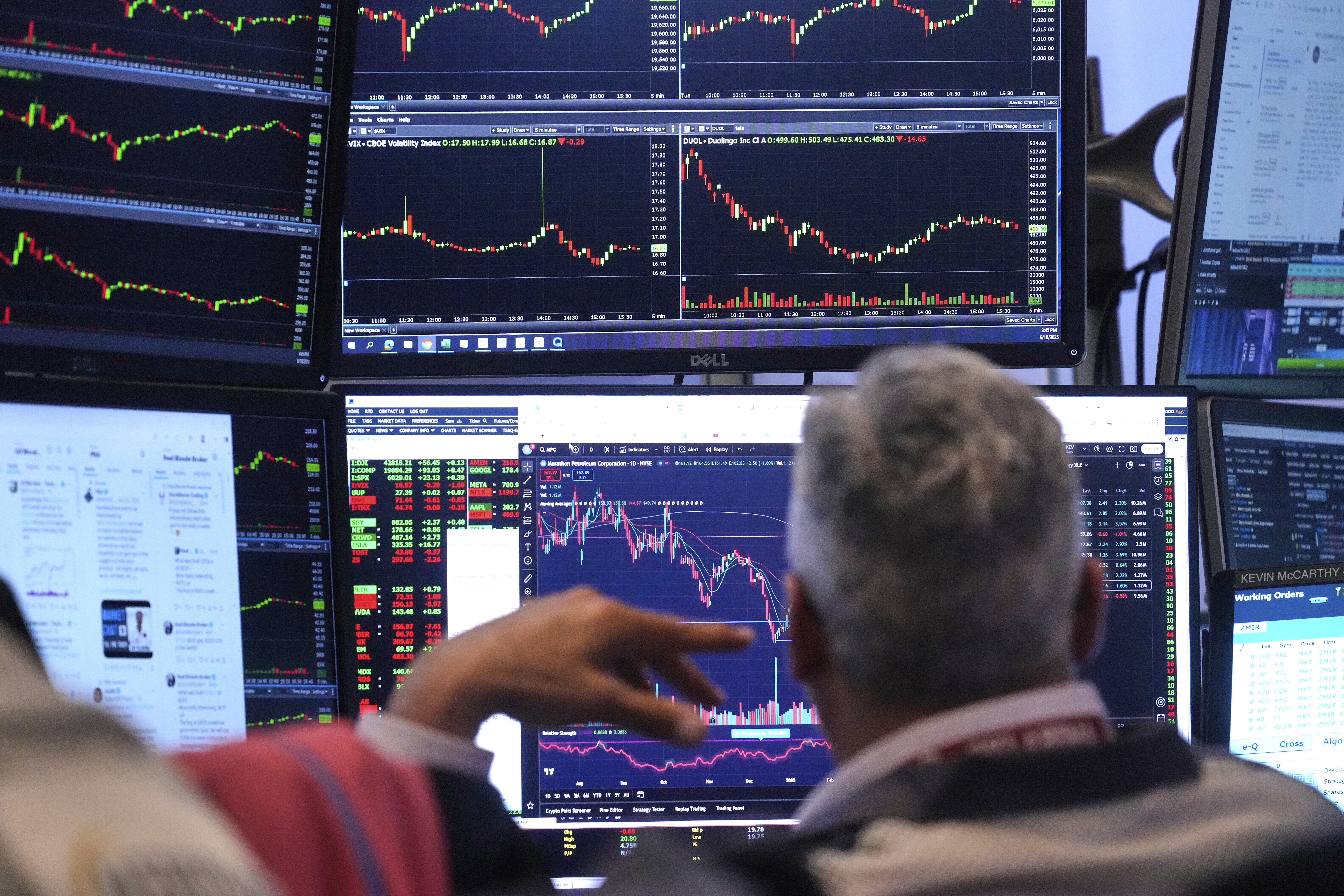 A trader watches his monitors as he works on the floor of the New York Stock Exchange, Tuesday, June 10, 2025. (AP Photo/Richard Drew)