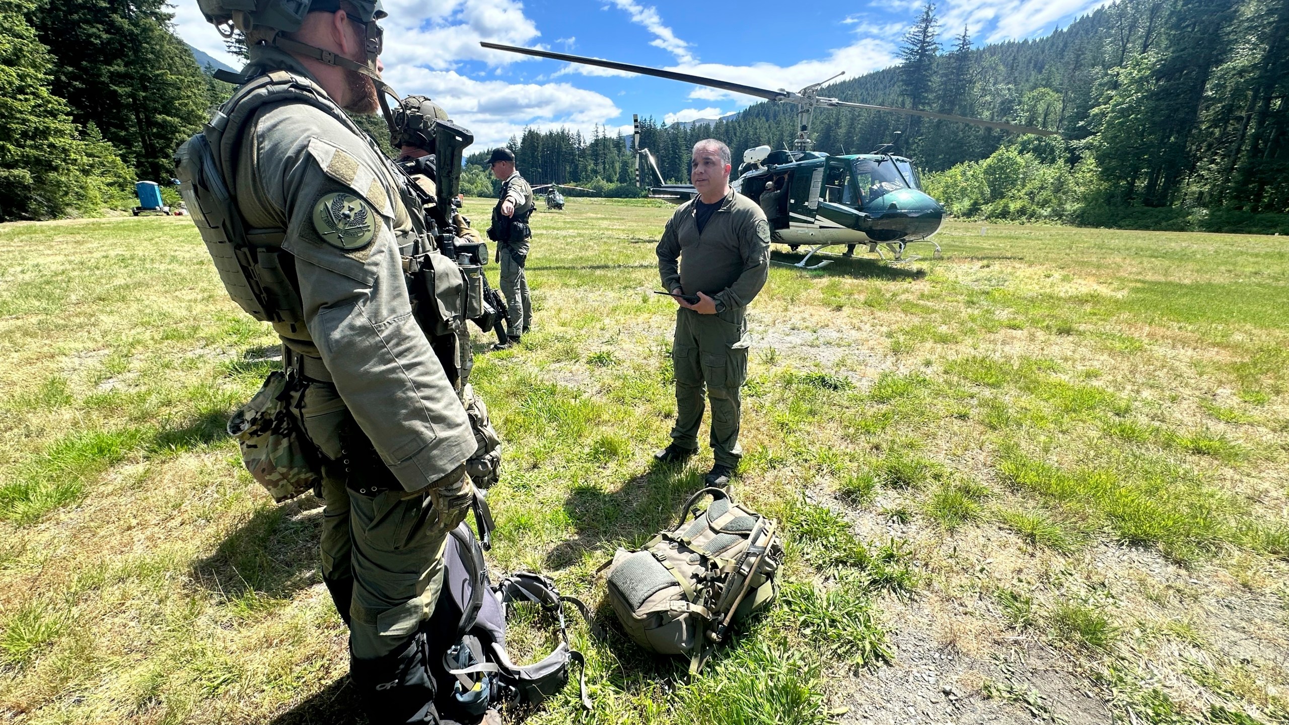In this handout photo provided by the Snohomish County Sheriff's Office deputies participate in the search for Travis Decker, at an undisclosed location in Washington state, Friday, June 6, 2025. (Snohomish County Sheriff's Office photo via AP)