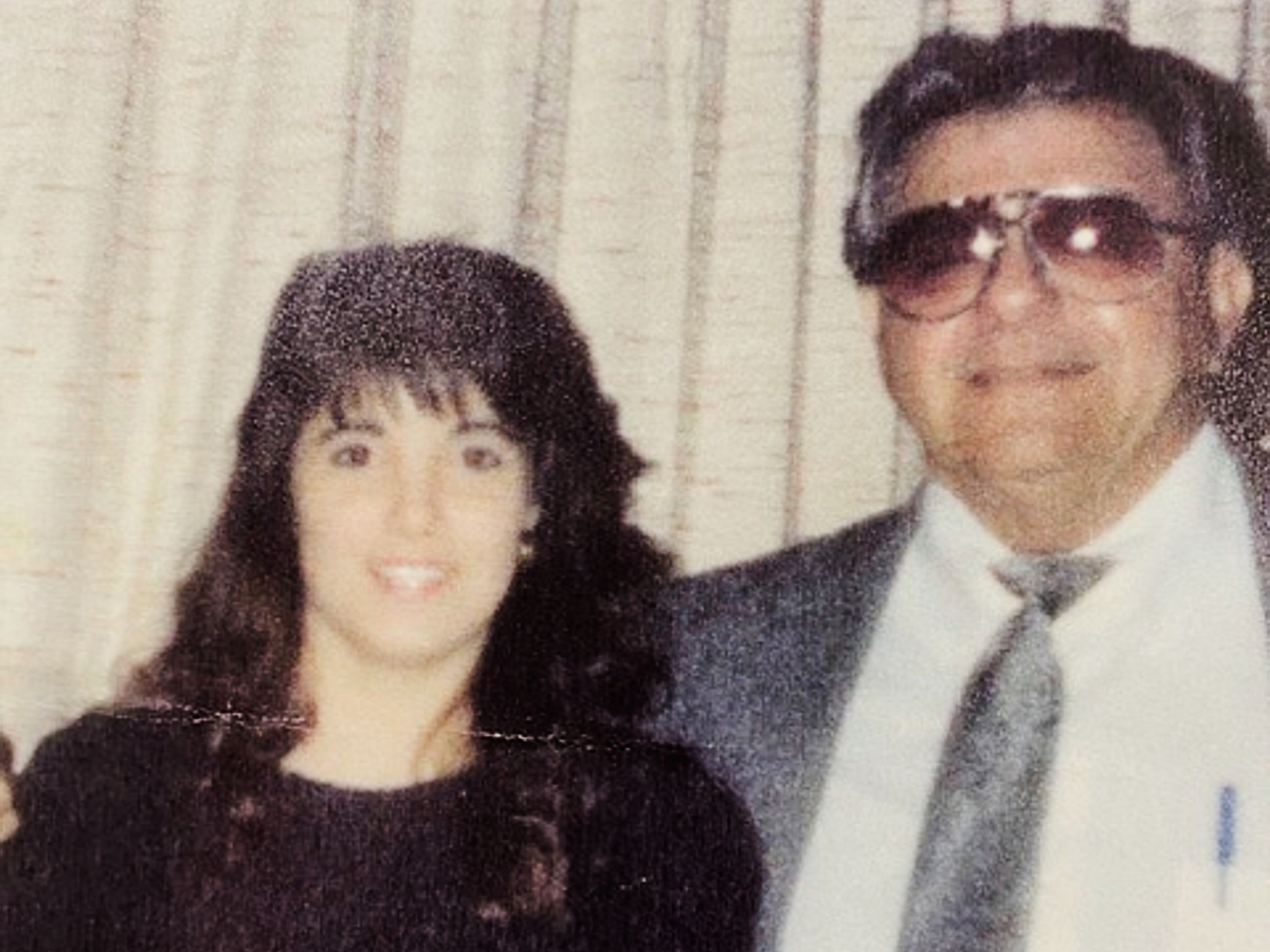 This undated photo released by Maria David shows her sister, Carmen Gayheart, posing with their father, Richard Tortora. (Maria David via AP)