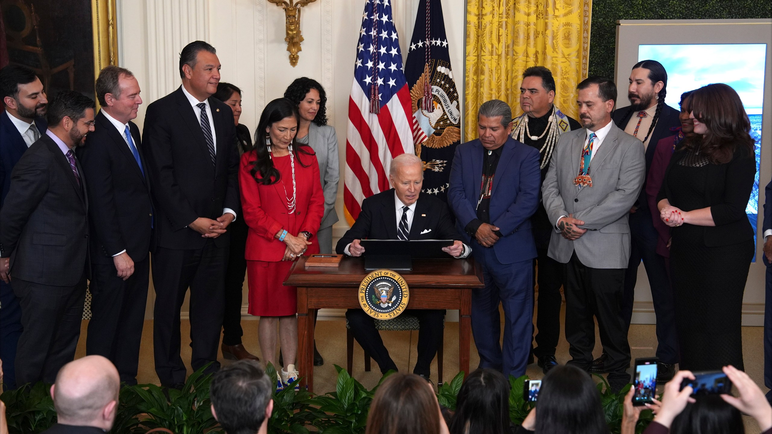 FILE - President Joe Biden signs a proclamation to establish the Chuckwalla National Monument and the Sáttítla Highlands National Monument during an event in the East Room of the White House, Jan. 14, 2025, in Washington. (AP Photo/Evan Vucci, File)