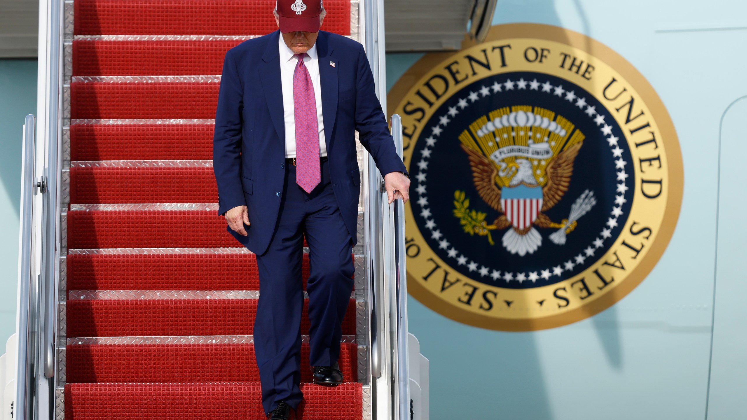President Donald Trump walks down the stairs of Air Force One upon his arrival at Joint Base Andrews, Md., Tuesday, June 10, 2025. (AP Photo/Luis M. Alvarez)