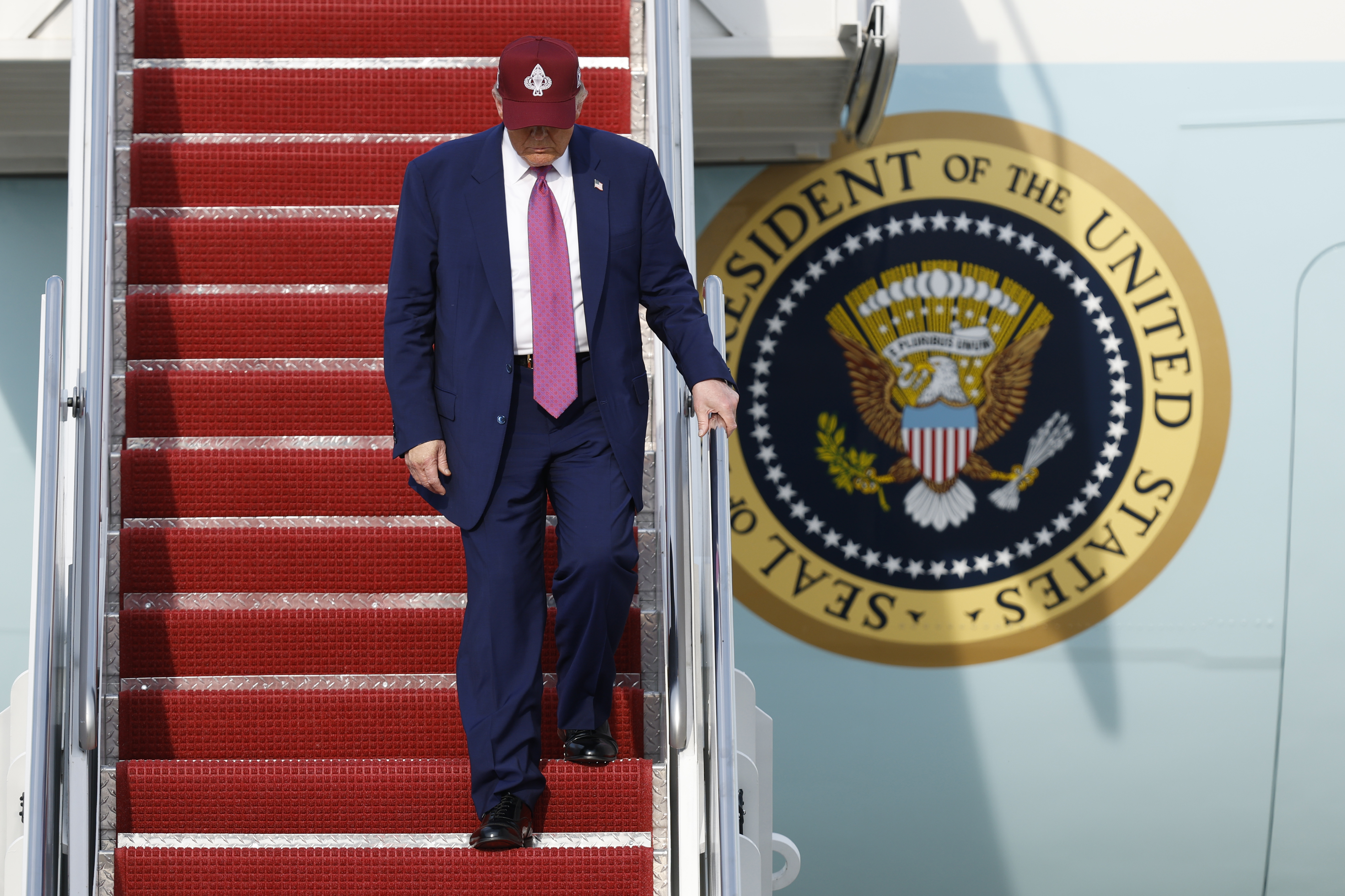 President Donald Trump walks down the stairs of Air Force One upon his arrival at Joint Base Andrews, Md., Tuesday, June 10, 2025. (AP Photo/Luis M. Alvarez)