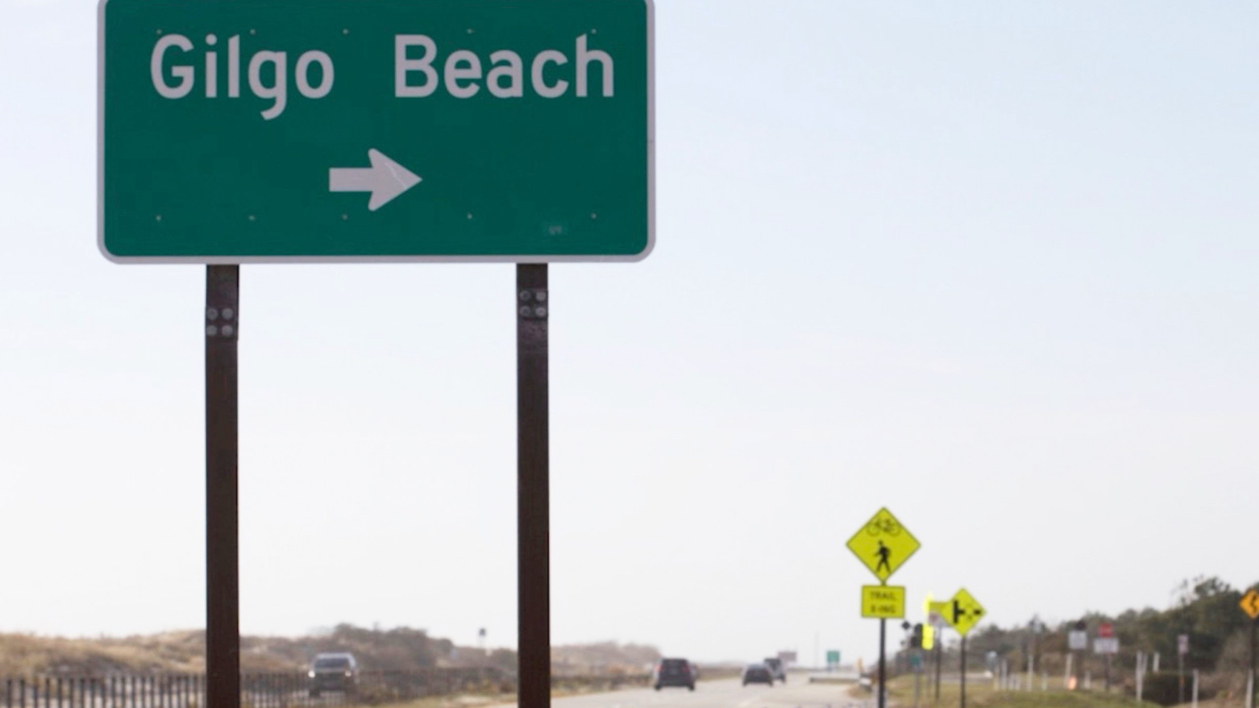 This image released by Peacock shows a street sign for Gilgo Beach in a scene from the documentary "The Gilgo Beach Killer: House of Secrets." (Peacock via AP)