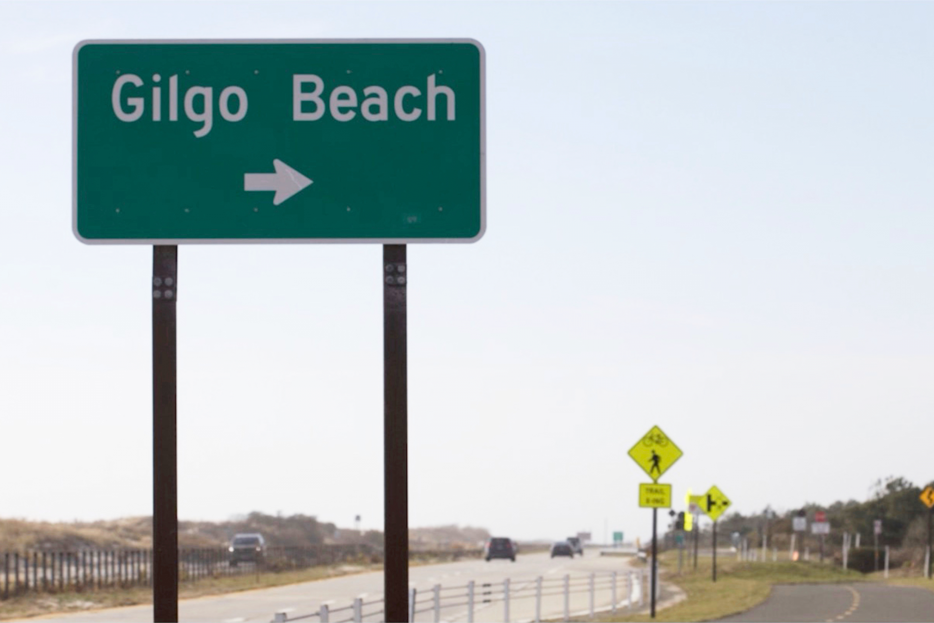 This image released by Peacock shows a street sign for Gilgo Beach in a scene from the documentary "The Gilgo Beach Killer: House of Secrets." (Peacock via AP)