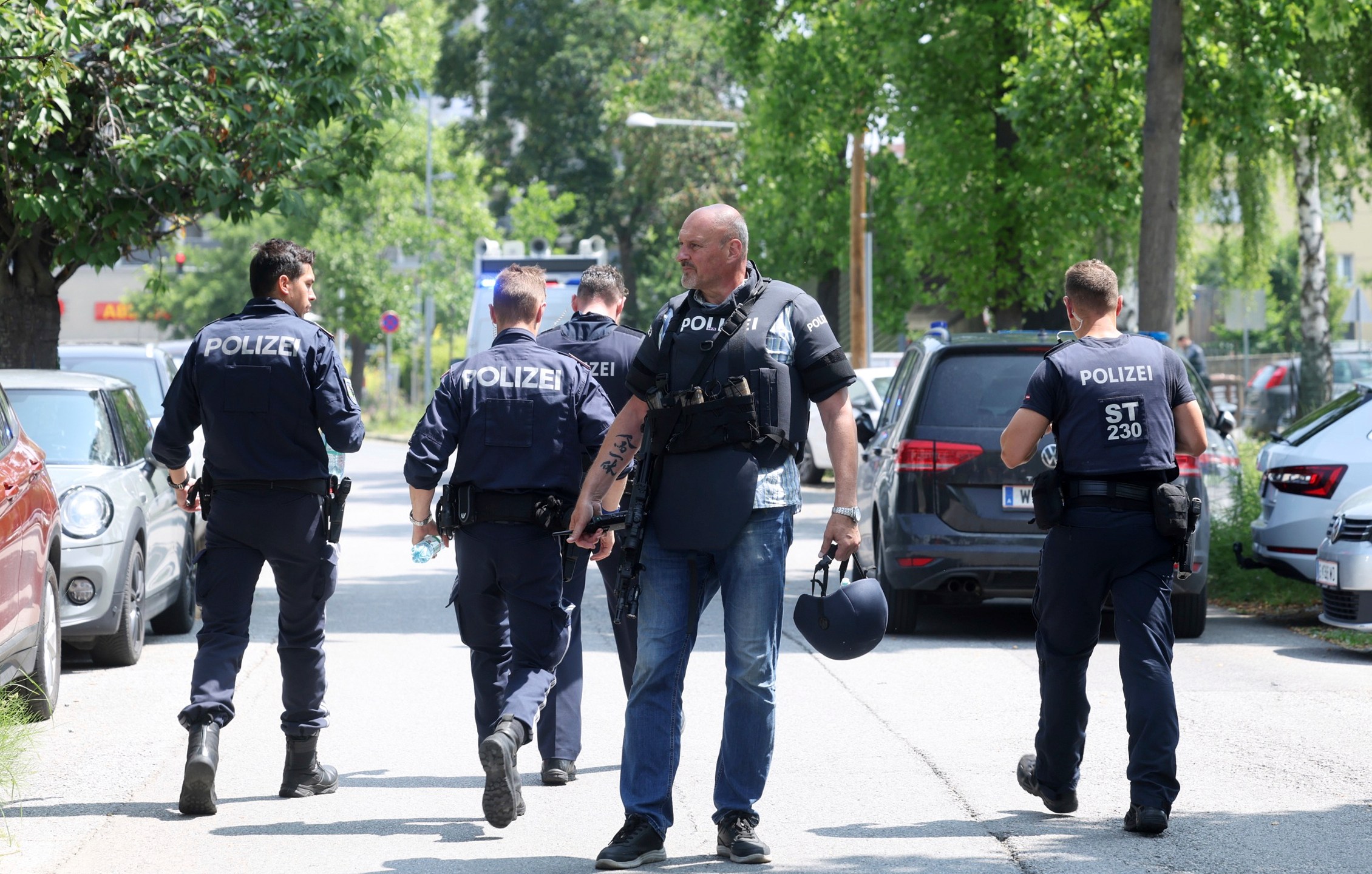 Police officers attend the scene of a shooting at a school in Graz, Austria, Tuesday, June 10, 2025. (Kleine Zeitung via AP)