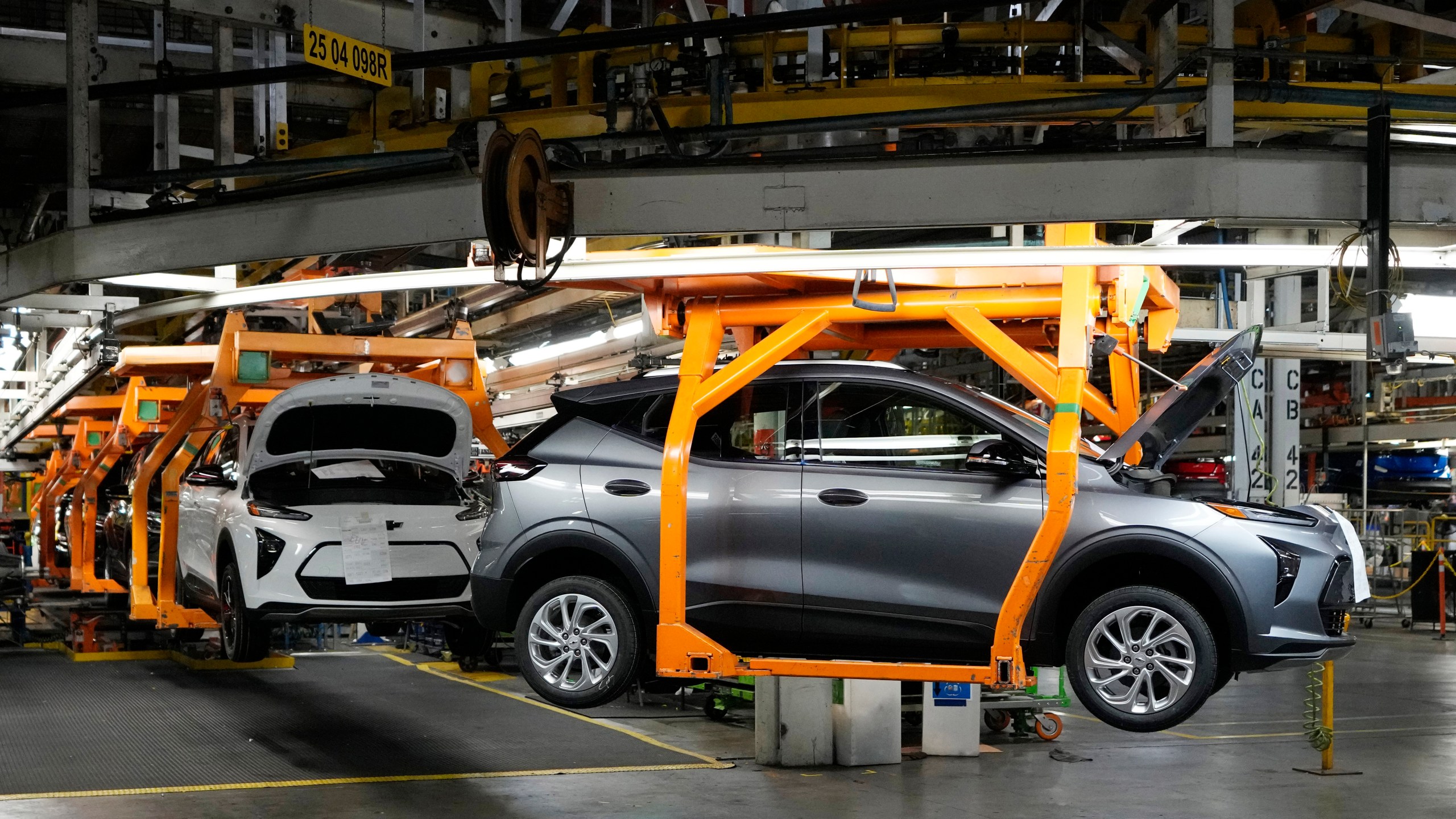 FILE - Vehicles move along the 2023 Chevrolet Bolt EV and EUV assembly line at the General Motors Orion Assembly June 15, 2023, in Lake Orion, Mich. (AP Photo/Carlos Osorio, File)