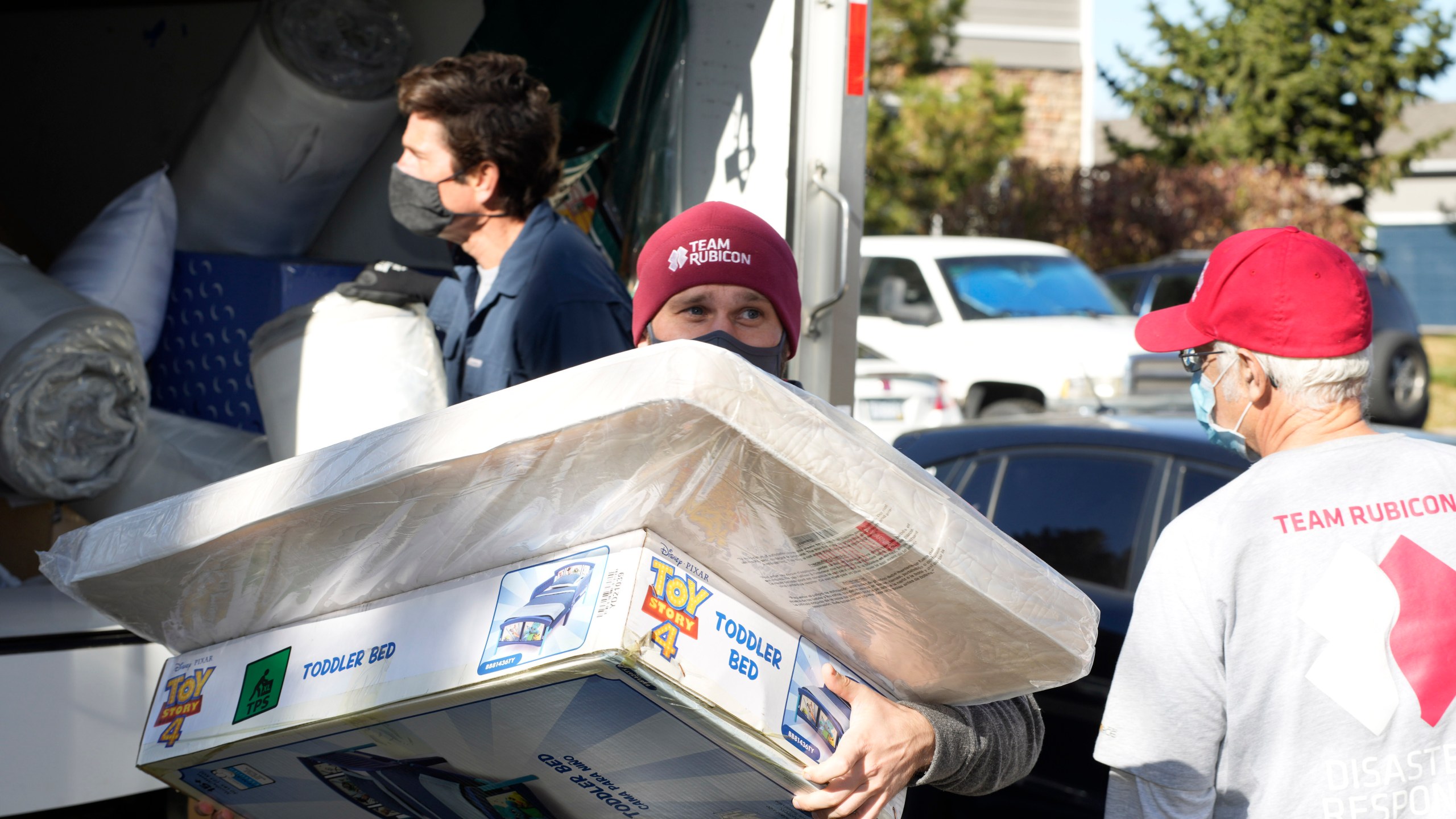 FILE - Team Rubicon volunteer Nicholas Duchnowski of Broomfield, Colo., moves belongings into an apartment that will be home to Afghan refugees, in the north Denver suburb of Thornton, Colo., Nov. 10, 2021. (AP Photo/David Zalubowski, Filepronto)