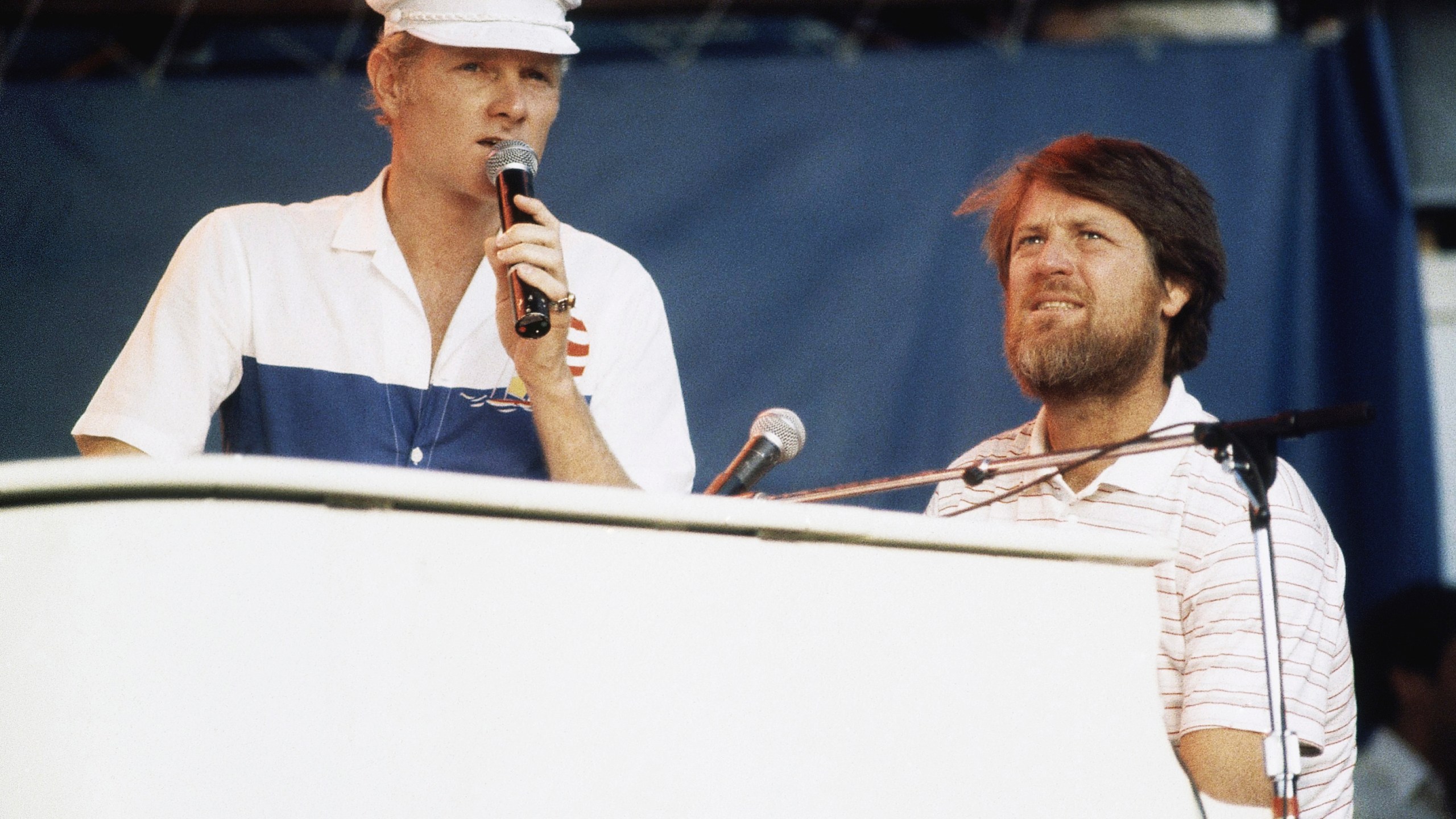 FILE - Mike Love, left, and Brian Wilson of The Beach Boys, perform at the Miller Time concert on Pier 84 on July 8, 1983 in New York. (AP Photo/ David Handschuh, File)