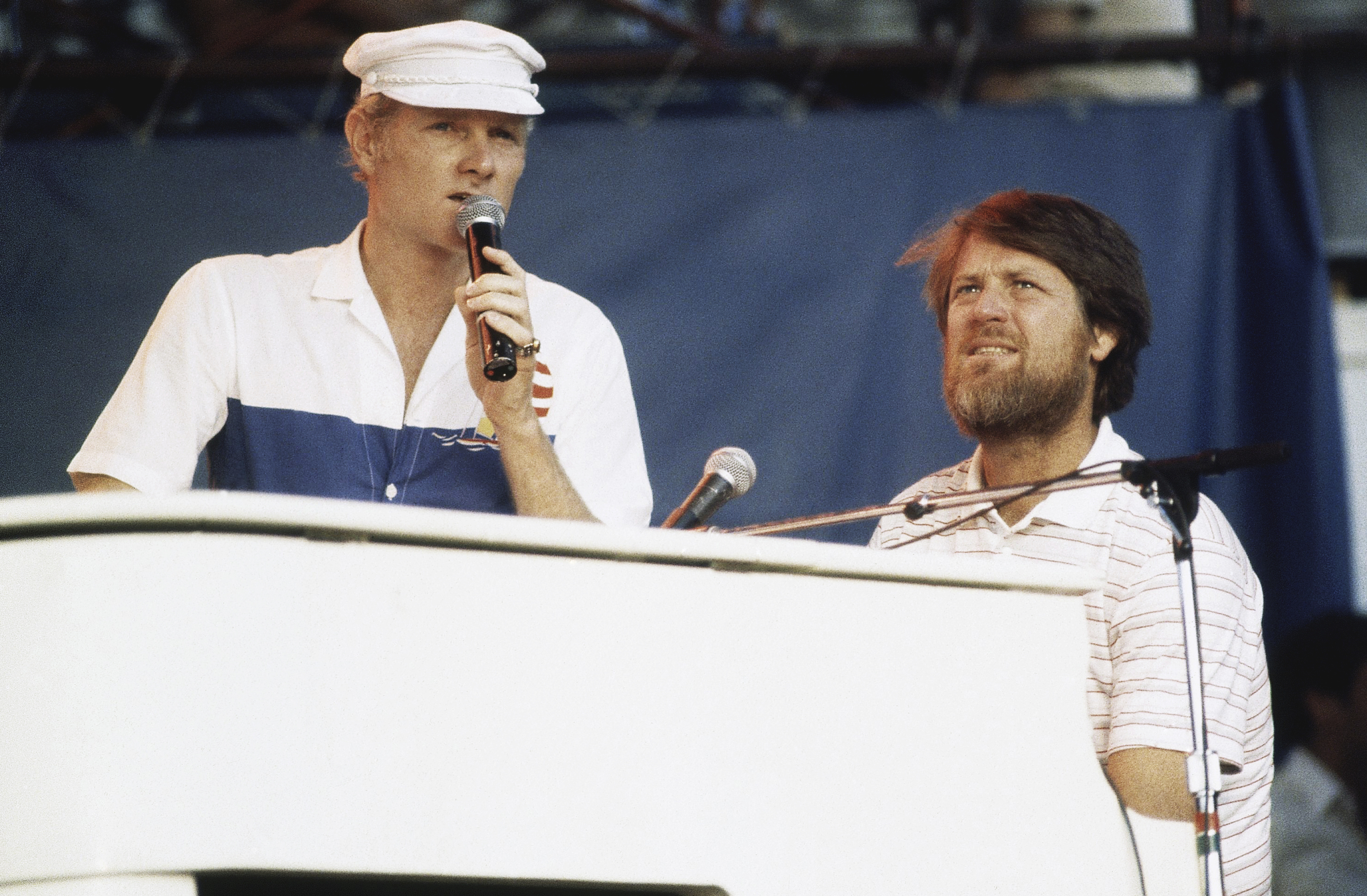 FILE - Mike Love, left, and Brian Wilson of The Beach Boys, perform at the Miller Time concert on Pier 84 on July 8, 1983 in New York. (AP Photo/ David Handschuh, File)