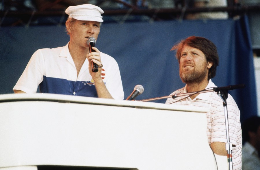 FILE - Mike Love, left, and Brian Wilson of The Beach Boys, perform at the Miller Time concert on Pier 84 on July 8, 1983 in New York. (AP Photo/ David Handschuh, File)