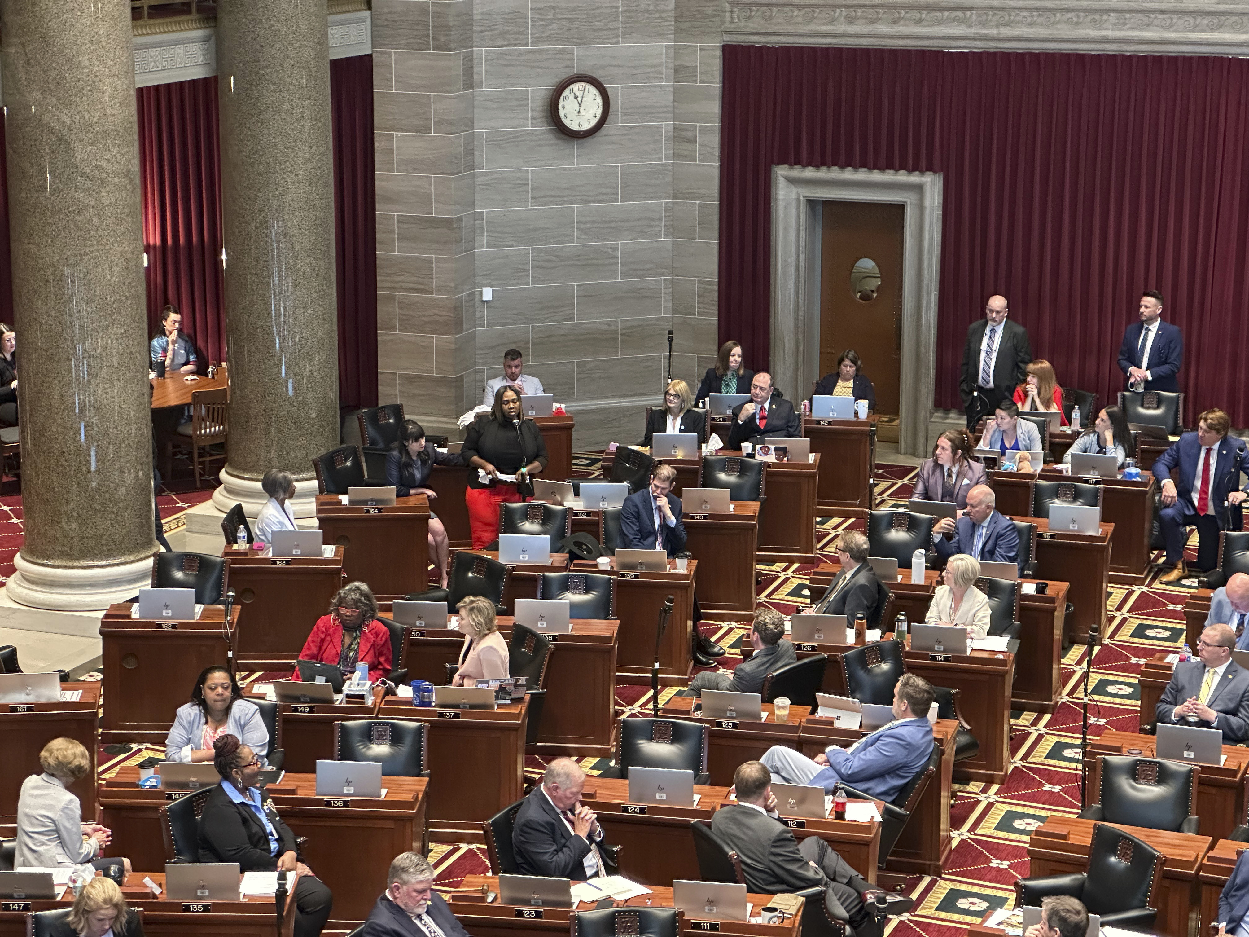 Missouri state Rep. Kimberly-Ann Collins describes for fellow lawmakers gathered in Jefferson City for a special session on Wednesday, June 11, 2025, how she watched a tornado hit her St. Louis home a month earlier. (AP Photo/David A. Lieb)
