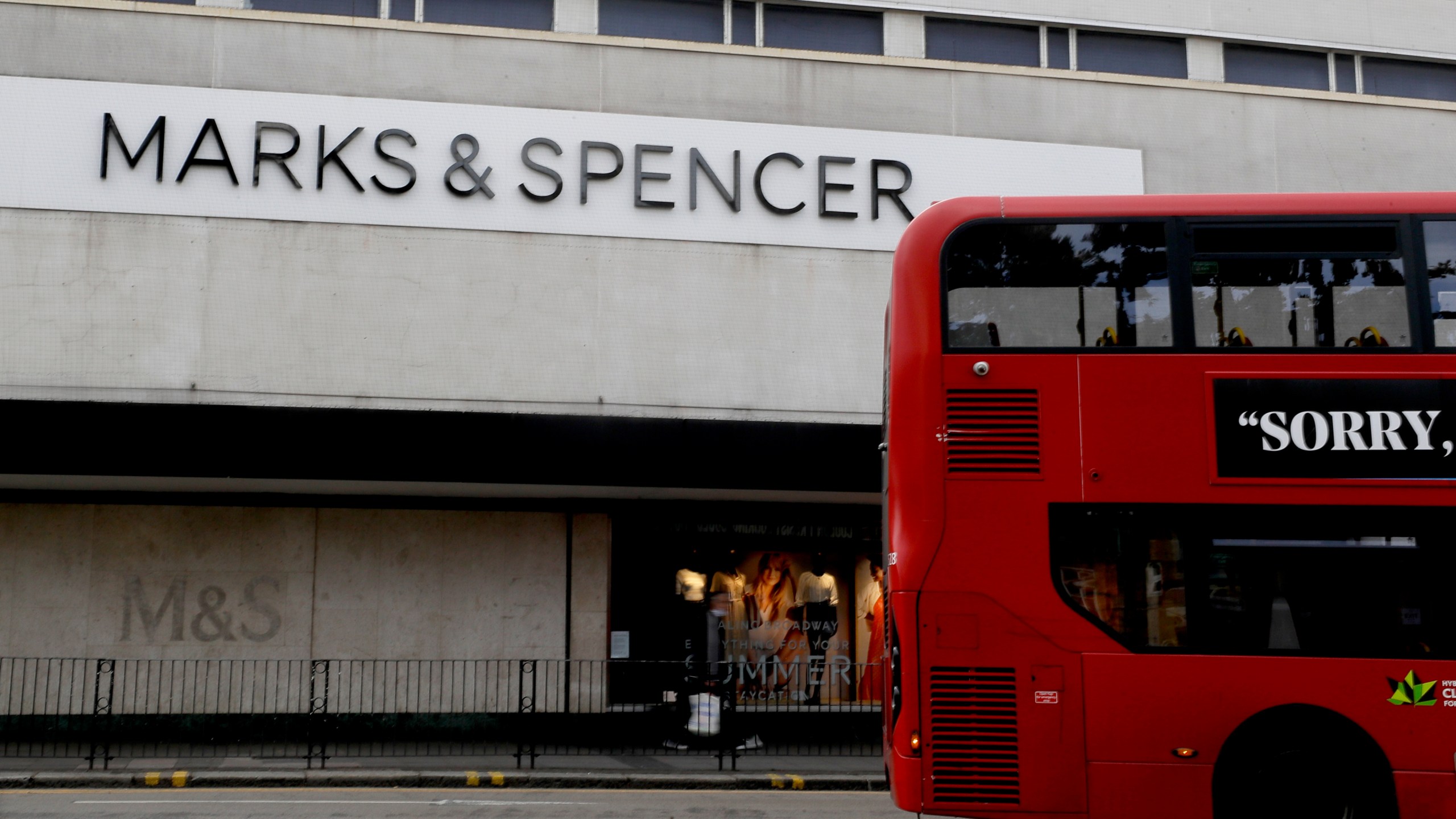 FILE - A bus passes a branch of Marks and Spencer in London, Tuesday, Aug. 18, 2020. (AP Photo/Kirsty Wigglesworth, file)