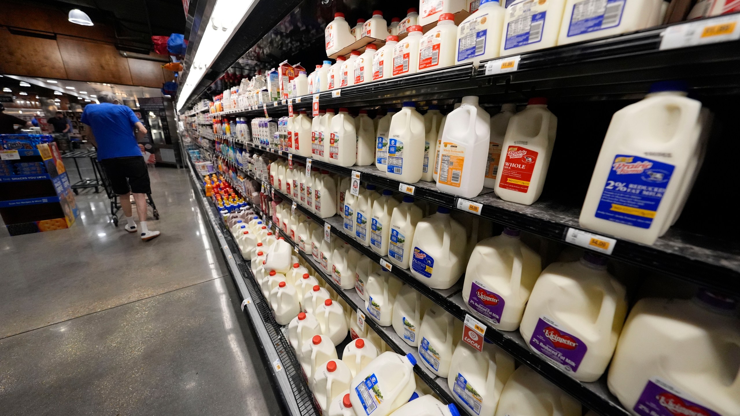 FILE - Dairy products line the cooler at a grocery store in New Orleans, April 17, 2024. (AP Photo/Gerald Herbert, File)