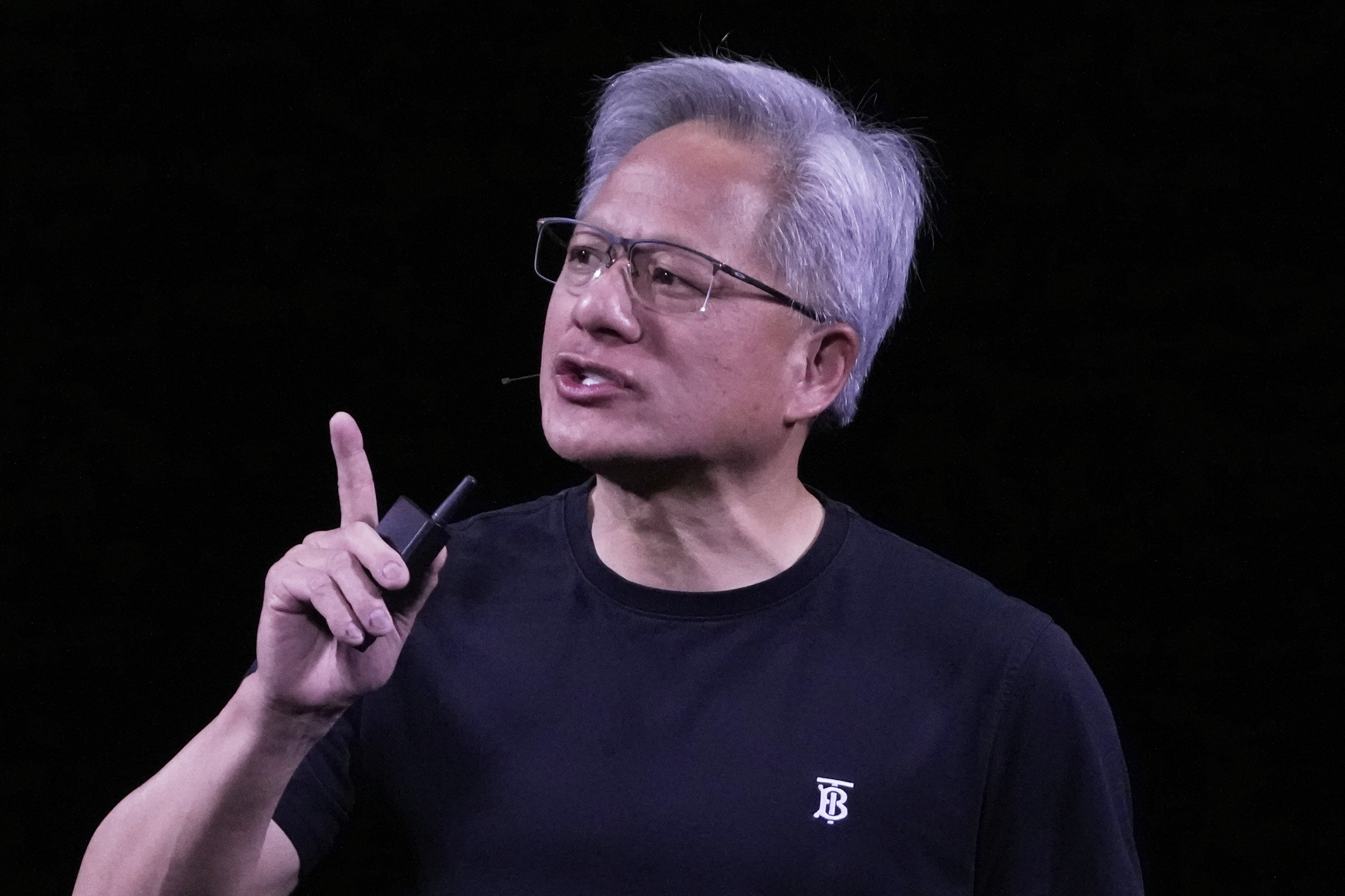 NVIDIA CEO Jensen Huang delivers his keynote address Wednesday, June 11, 2025 at the Vivatech fair in Paris. (AP Photo/Michel Euler)