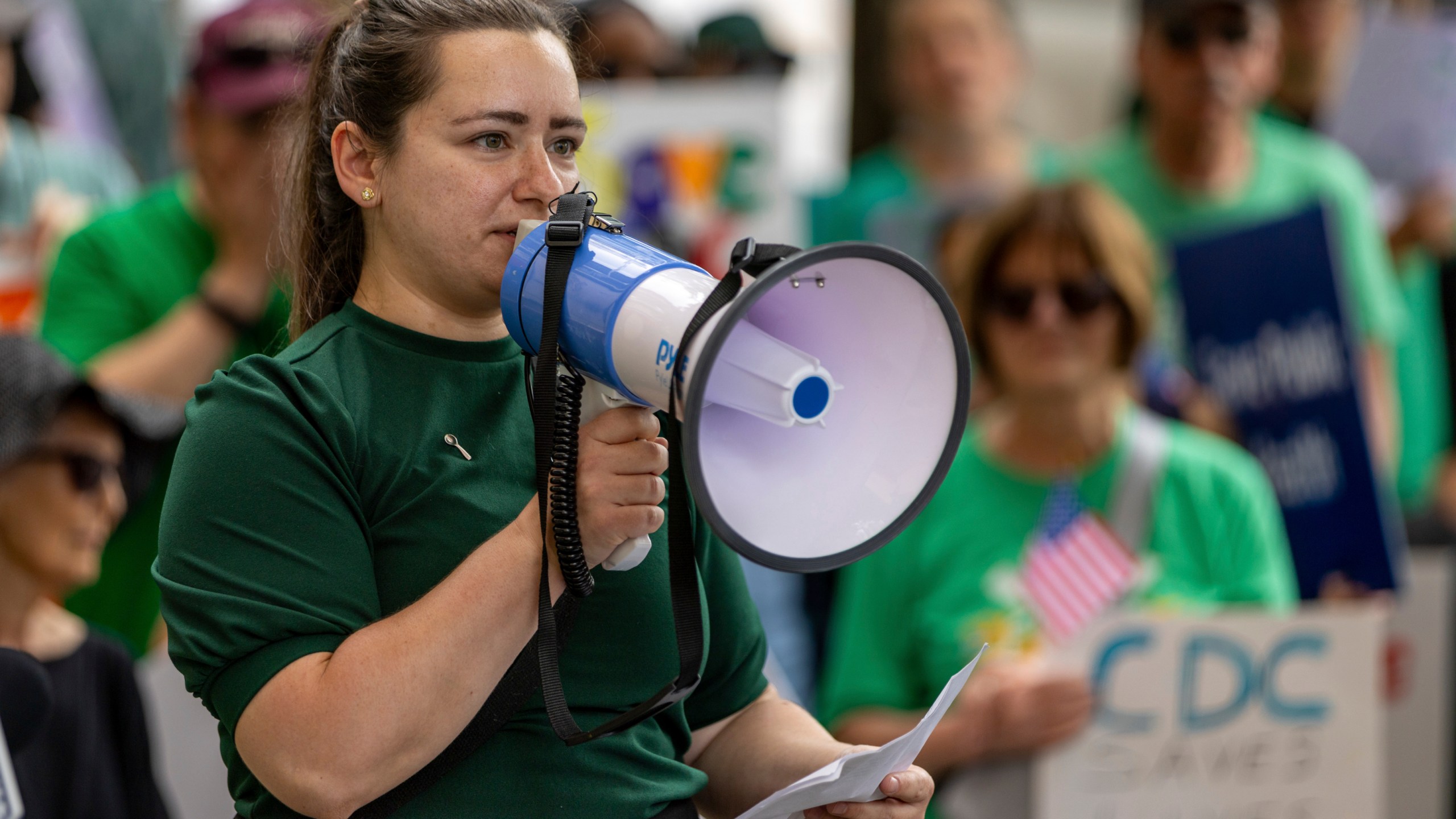 Anna Yousaf speaks at a demonstration protesting President Donald Trump's proposed cuts to health services outside Centers for Disease Control and Prevention (CDC) headquarters in Atlanta on Tuesday, June 10, 2025. (Arvin Temkar/Atlanta Journal-Constitution via AP)