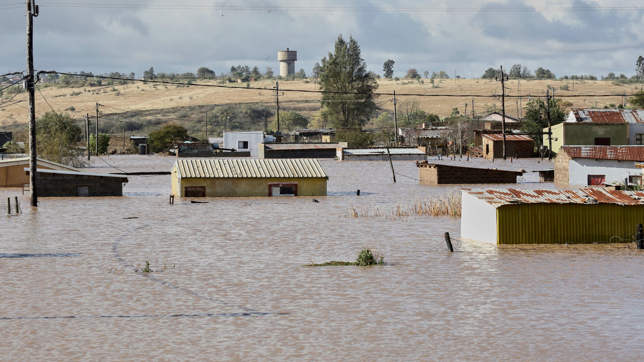 A view of homes submerged in floodwater, in Mthatha, South Africa, Tuesday, June 10, 2025. (AP Photo/Hoseya Jubase)