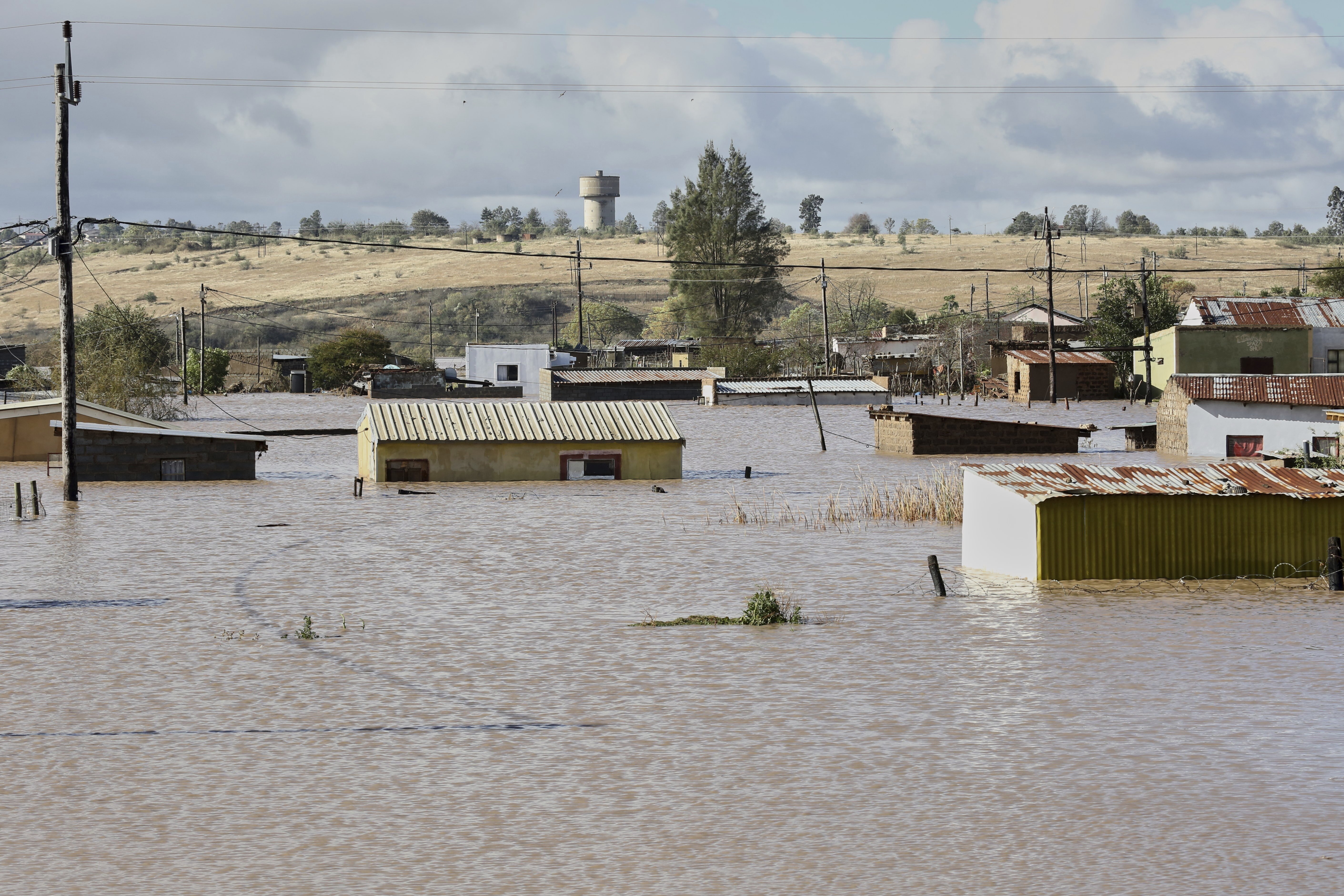 A view of homes submerged in floodwater, in Mthatha, South Africa, Tuesday, June 10, 2025. (AP Photo/Hoseya Jubase)